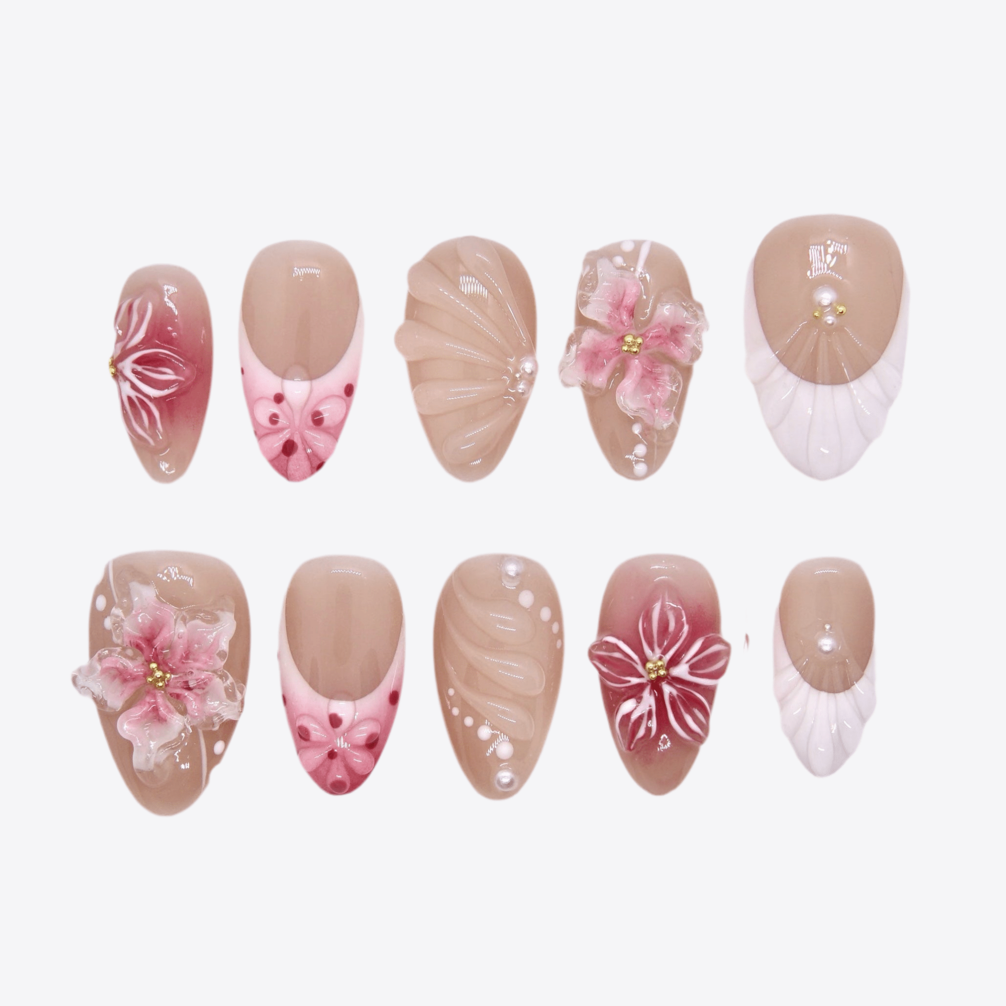 Nude tea press-on nails with 3D butterflies, floral details, and pearl accents from Sugar Dream Series.