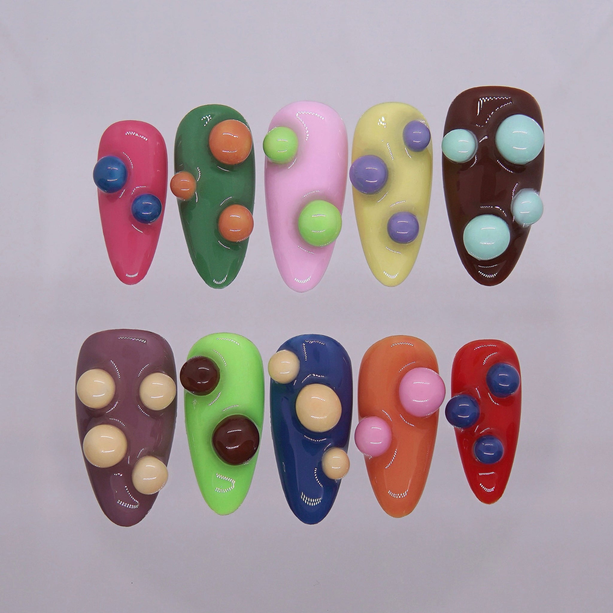 Candy-colored press-on nails with 3D gumball-like bubbles.