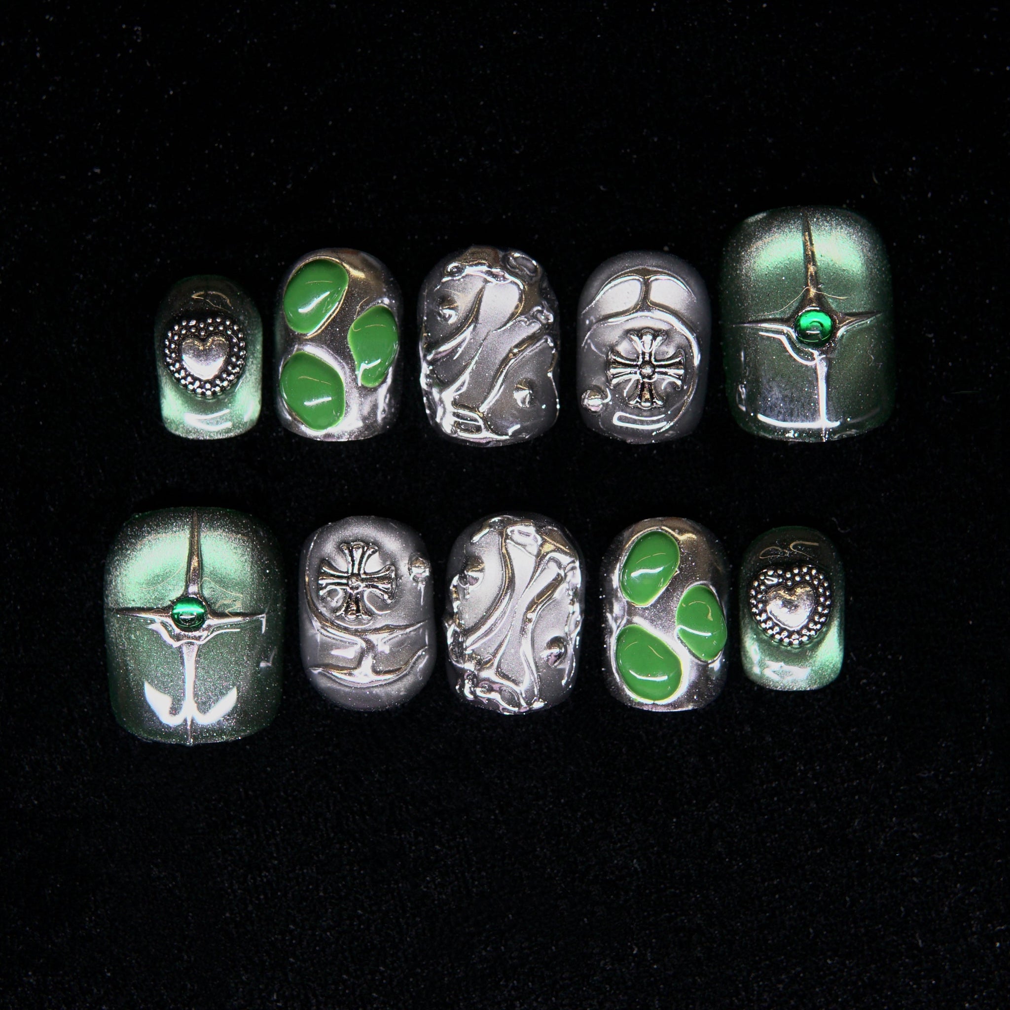Chamber No. IX press-on nails — emerald green chrome with metallic detailing.