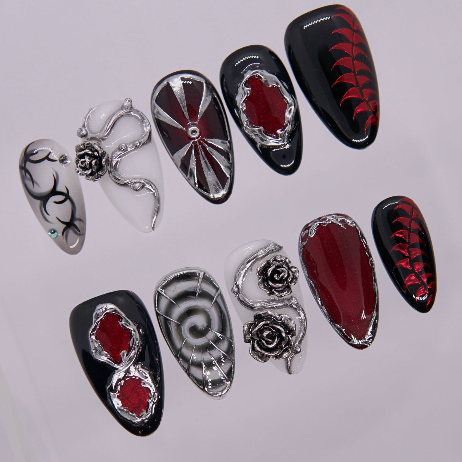 Close-up of red inlay surrounded by metallic silver veins..