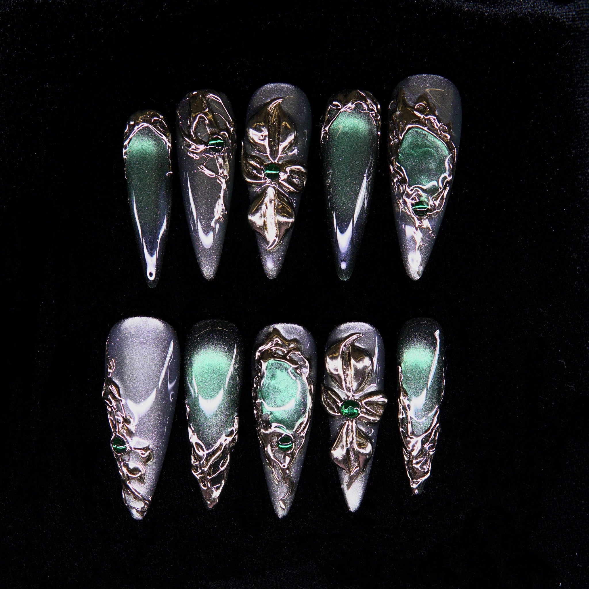 Emerald Sigil press-on nails — green chrome with silver sculptural sigil motifs.