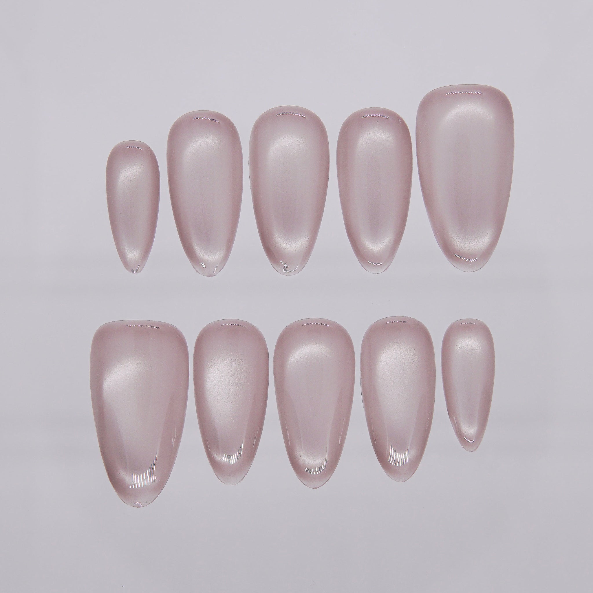 Muted mauve cat eye press-on nails with soft shimmer from Nailsium