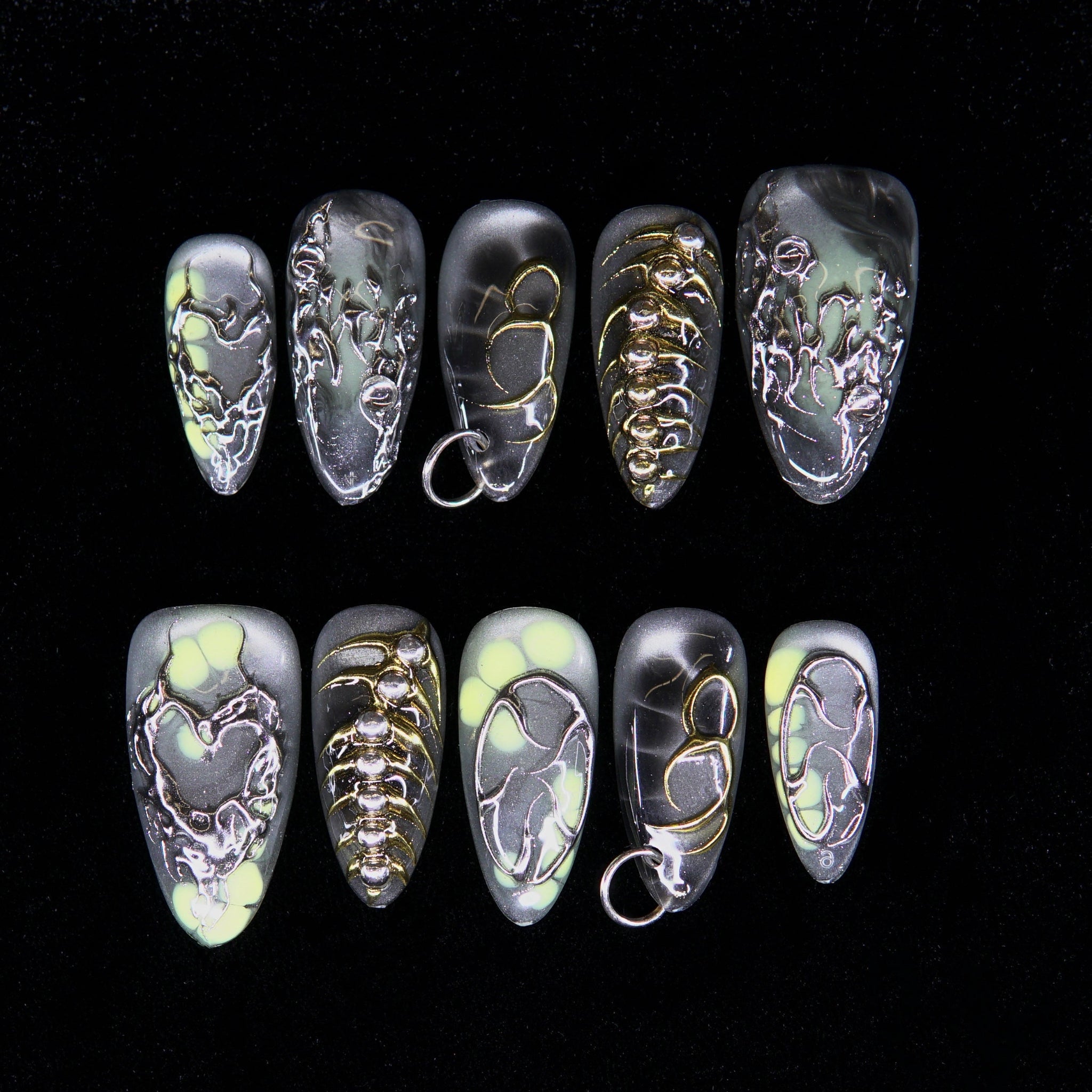 Sulfur Bloom press-on nails — matte grey with glowing yellow cores and chrome veins.