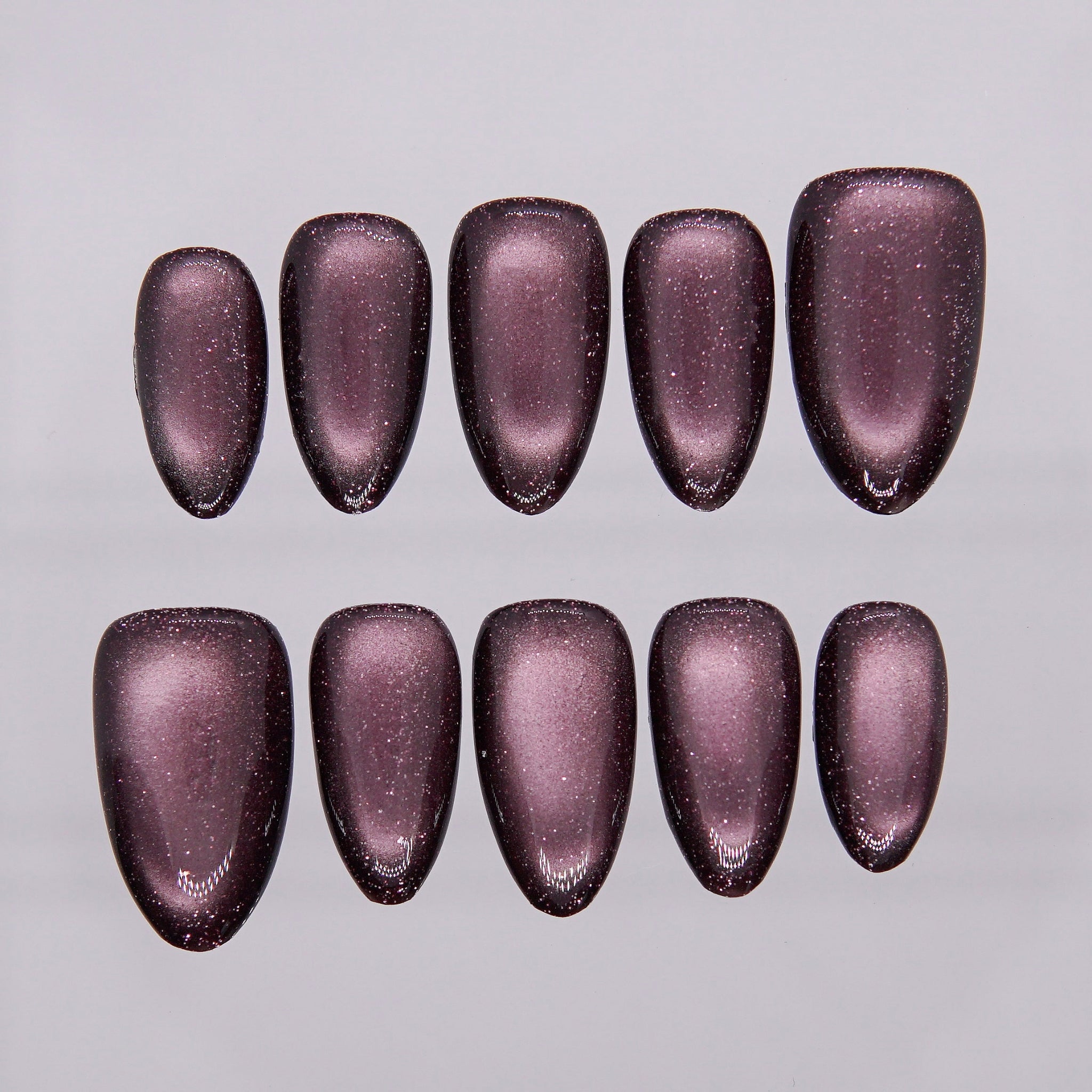 Burgundy cat eye press-on nails with deep shimmer from Flare series.
