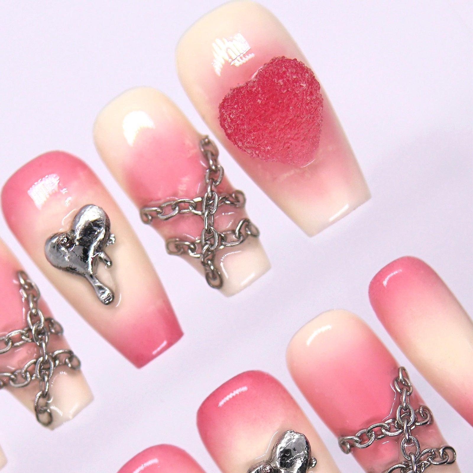 Soft pink and cream gradient press-on nails with glossy and matte finish.
