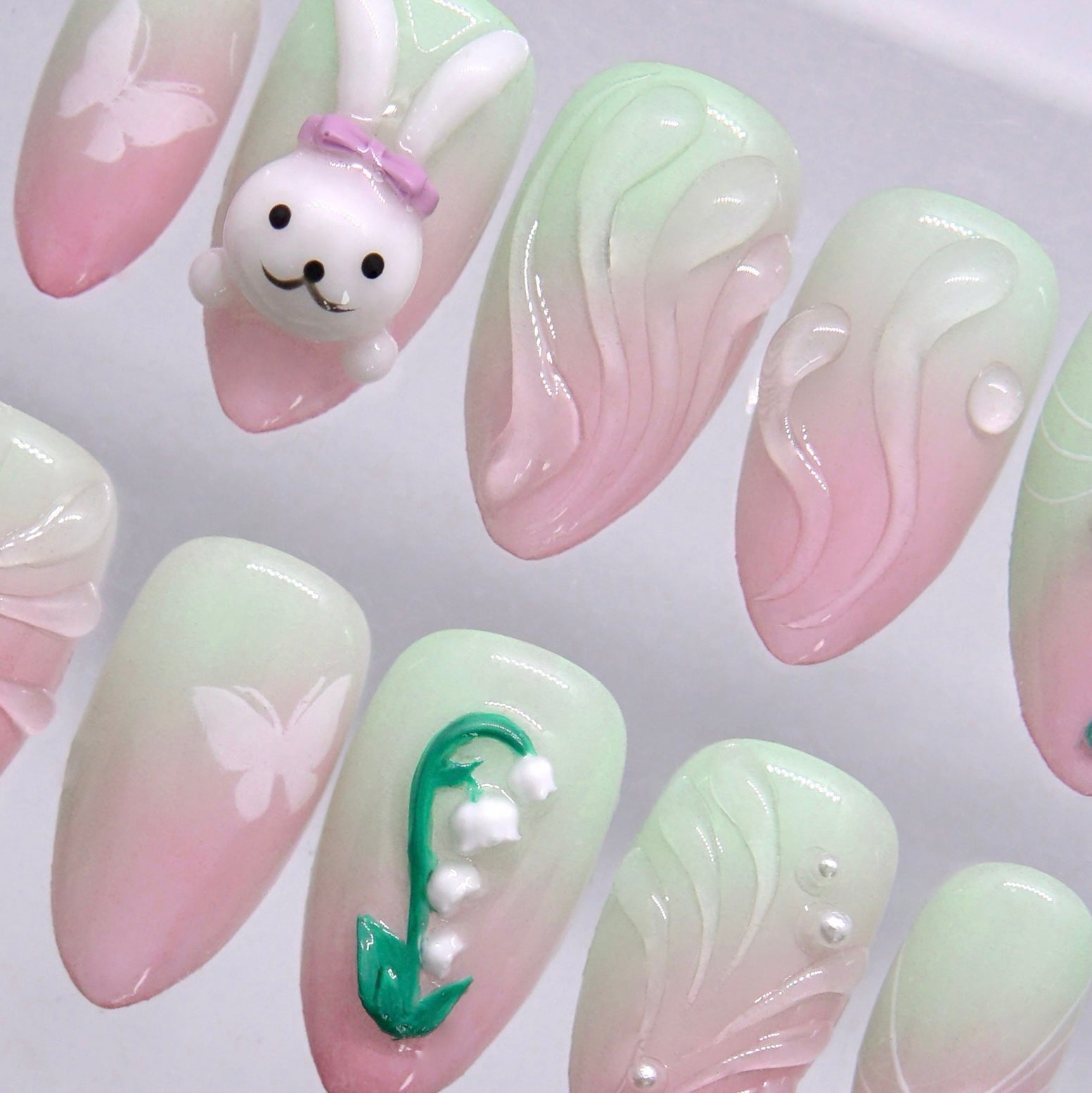 Soft gradient press on nails with green and blush tones