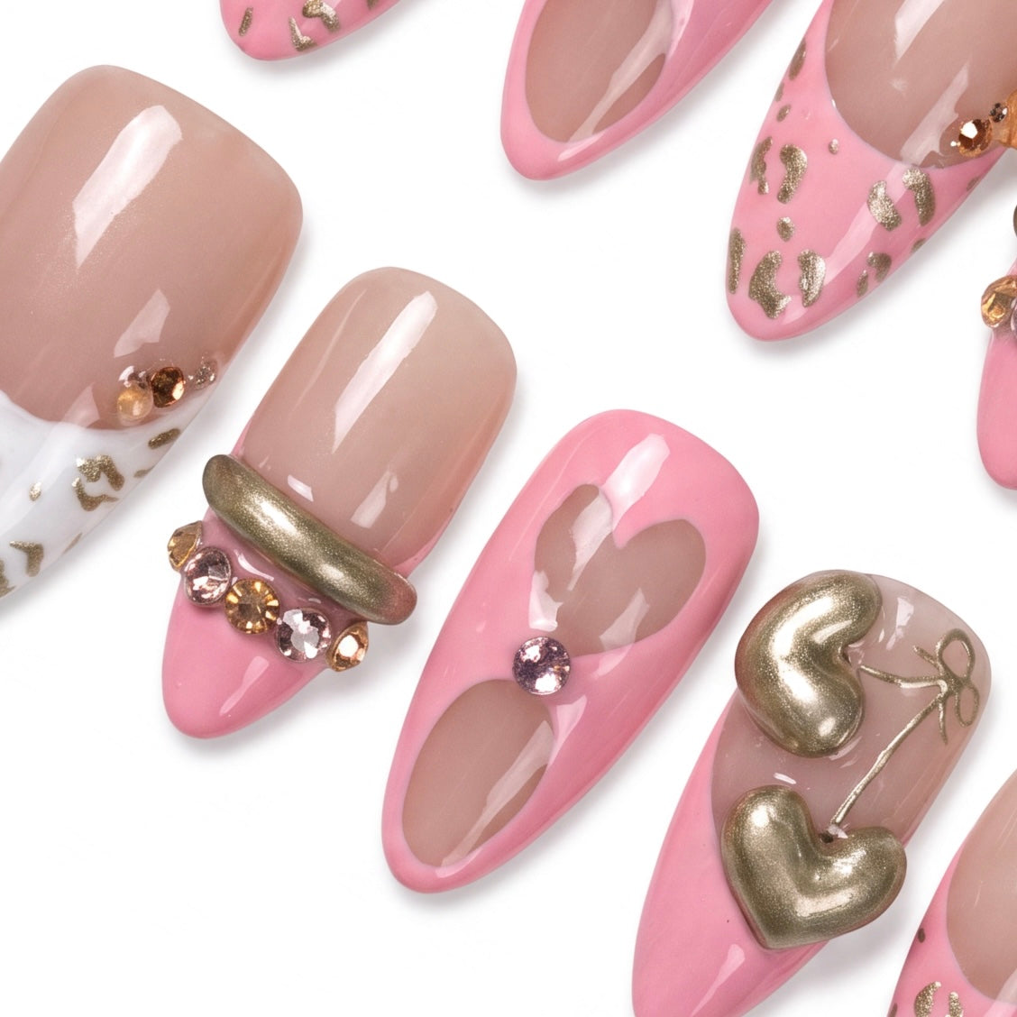 Detail view of Tiger zodiac Valentine nails with blush pink gradients, heart details, and gold embellishments.