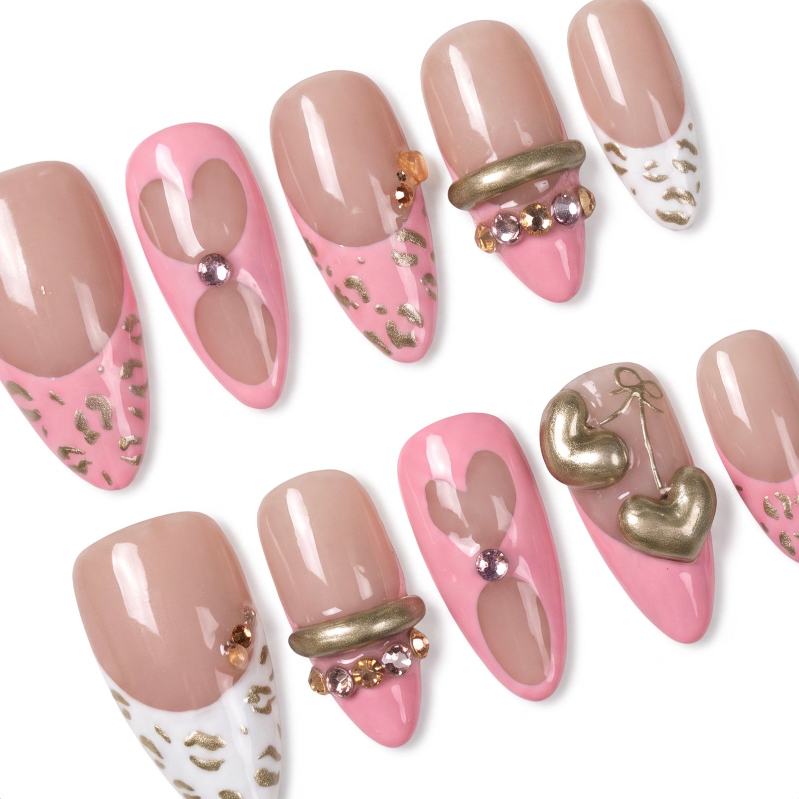 Close-up of Valor Tiger press-on nails showing gold sculptural accents and glossy nude finish.