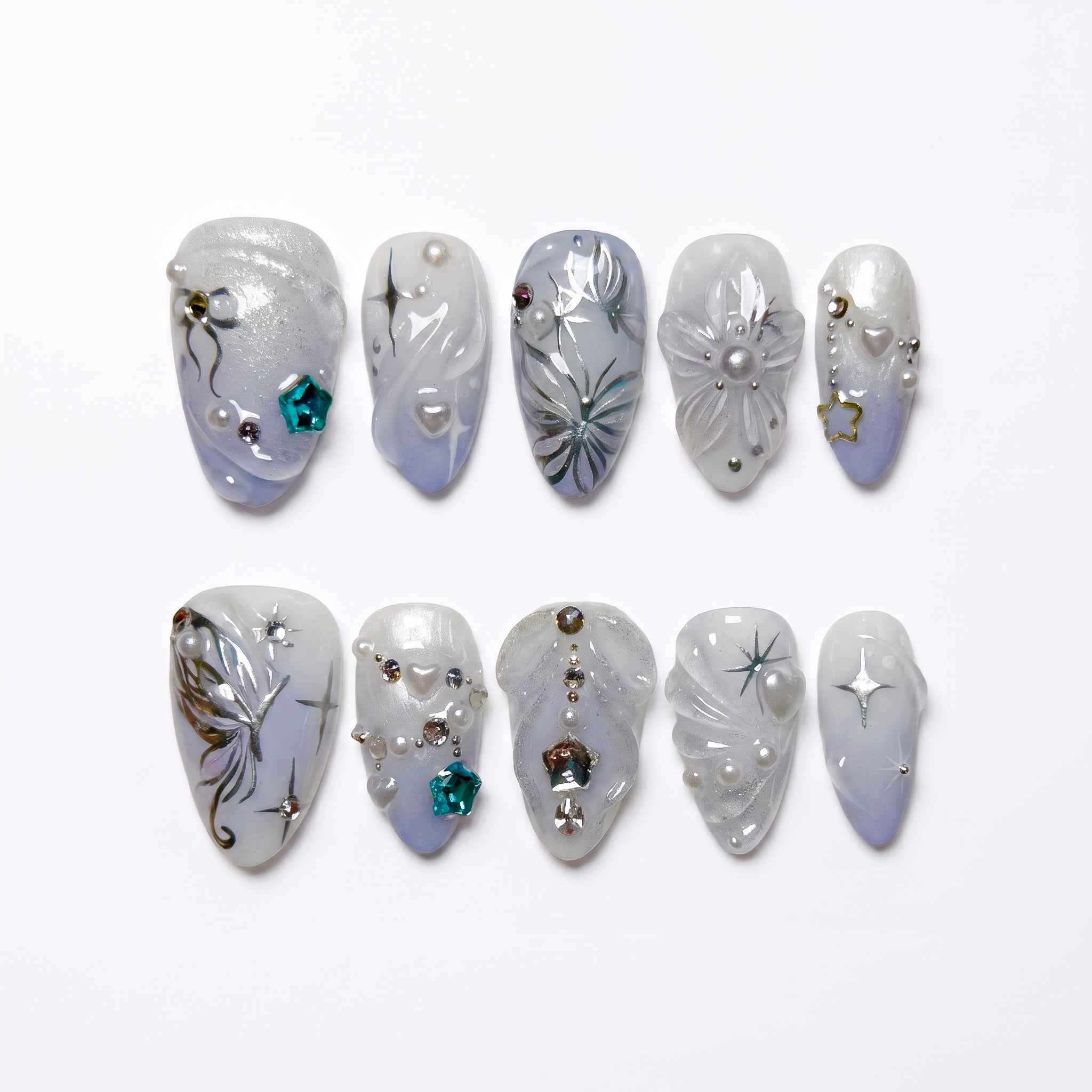 Moonlit Wings press-on nails with icy blue and pearly white gradient, silver butterflies, and star accents – dreamy Water · Flow design by Nailsium.
