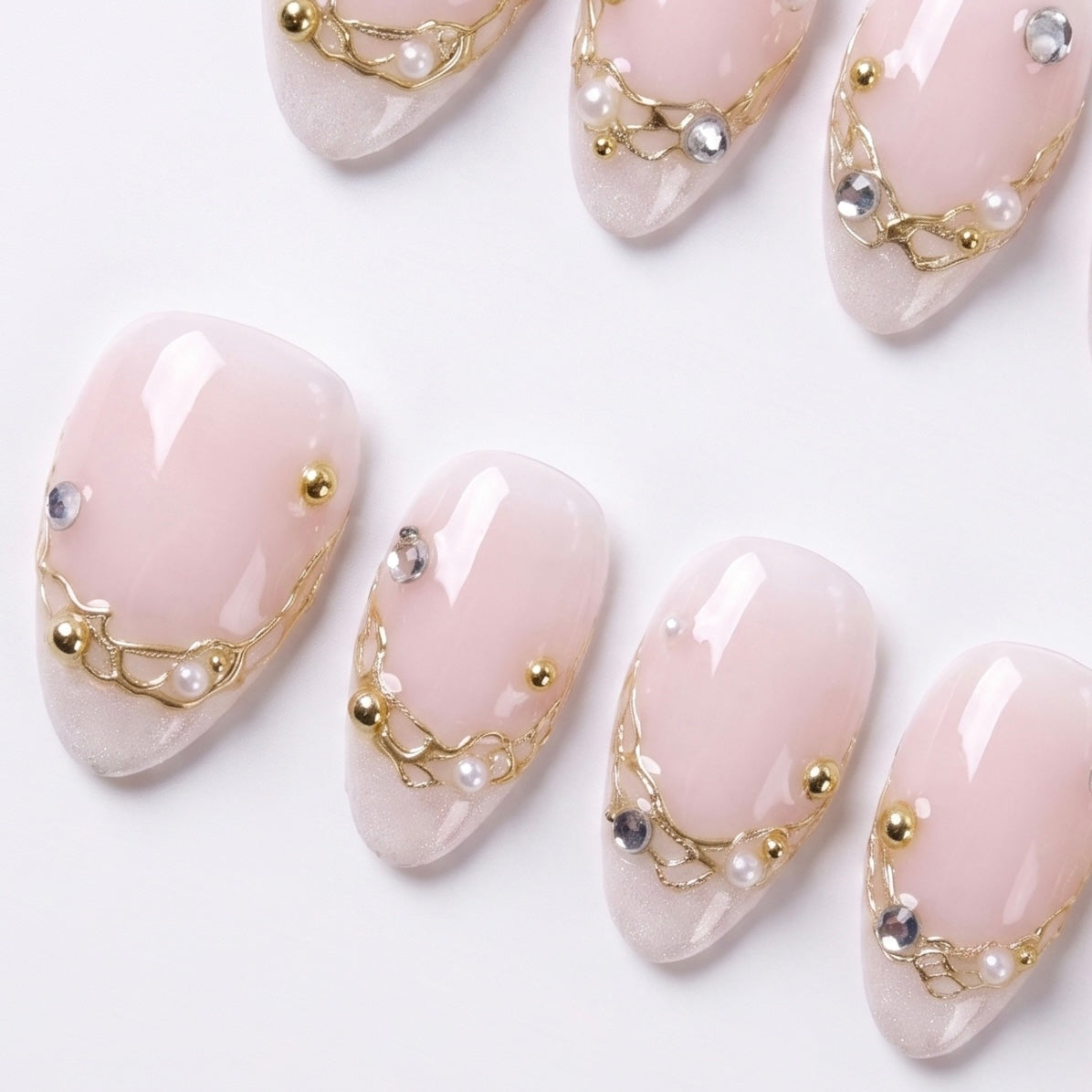 Minimal nail design with soft nude tones and subtle shine