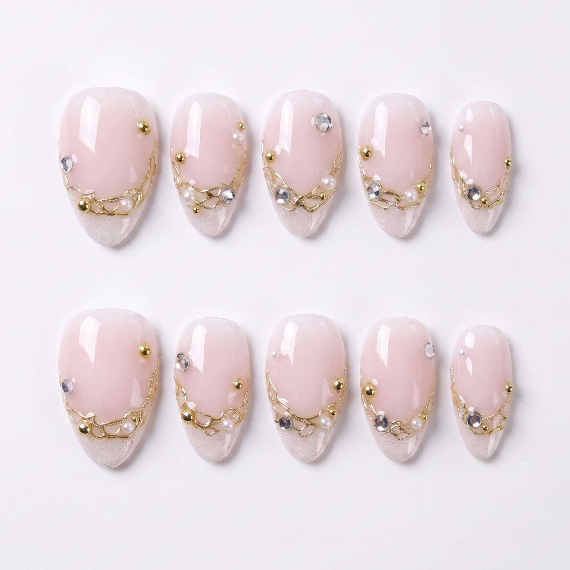 Nude press on lnails with gold accents and clean minimalist design 