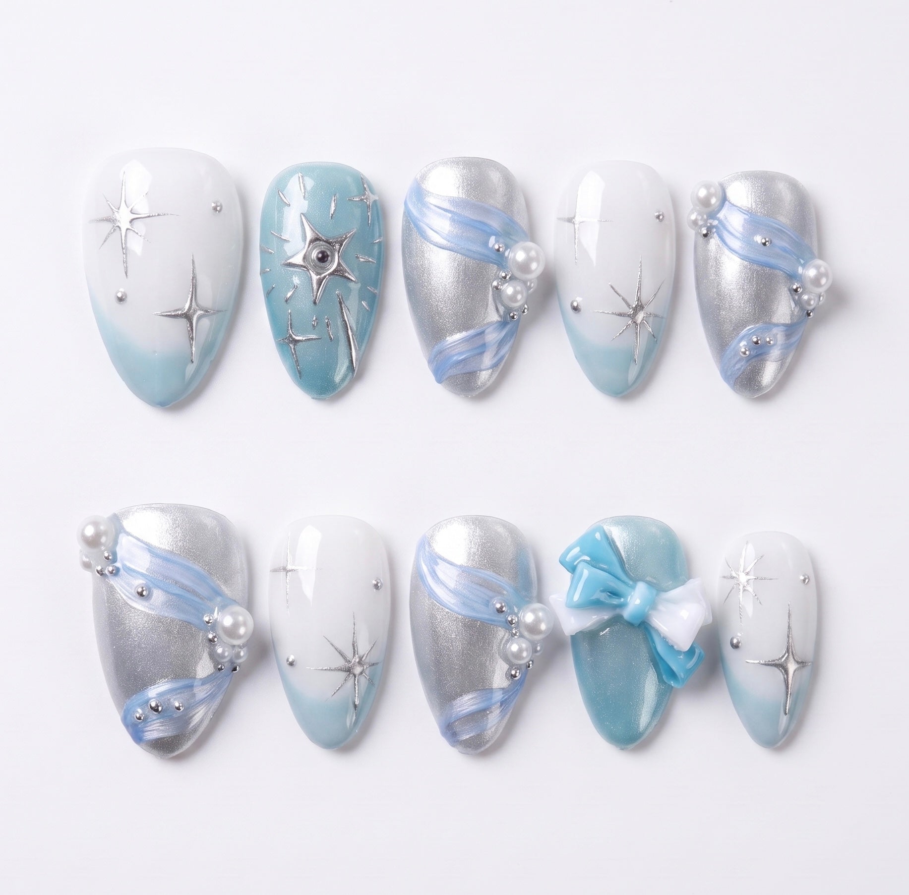 Blue press on nails with bow detail, shimmer finish, and dreamy fairy-inspired design