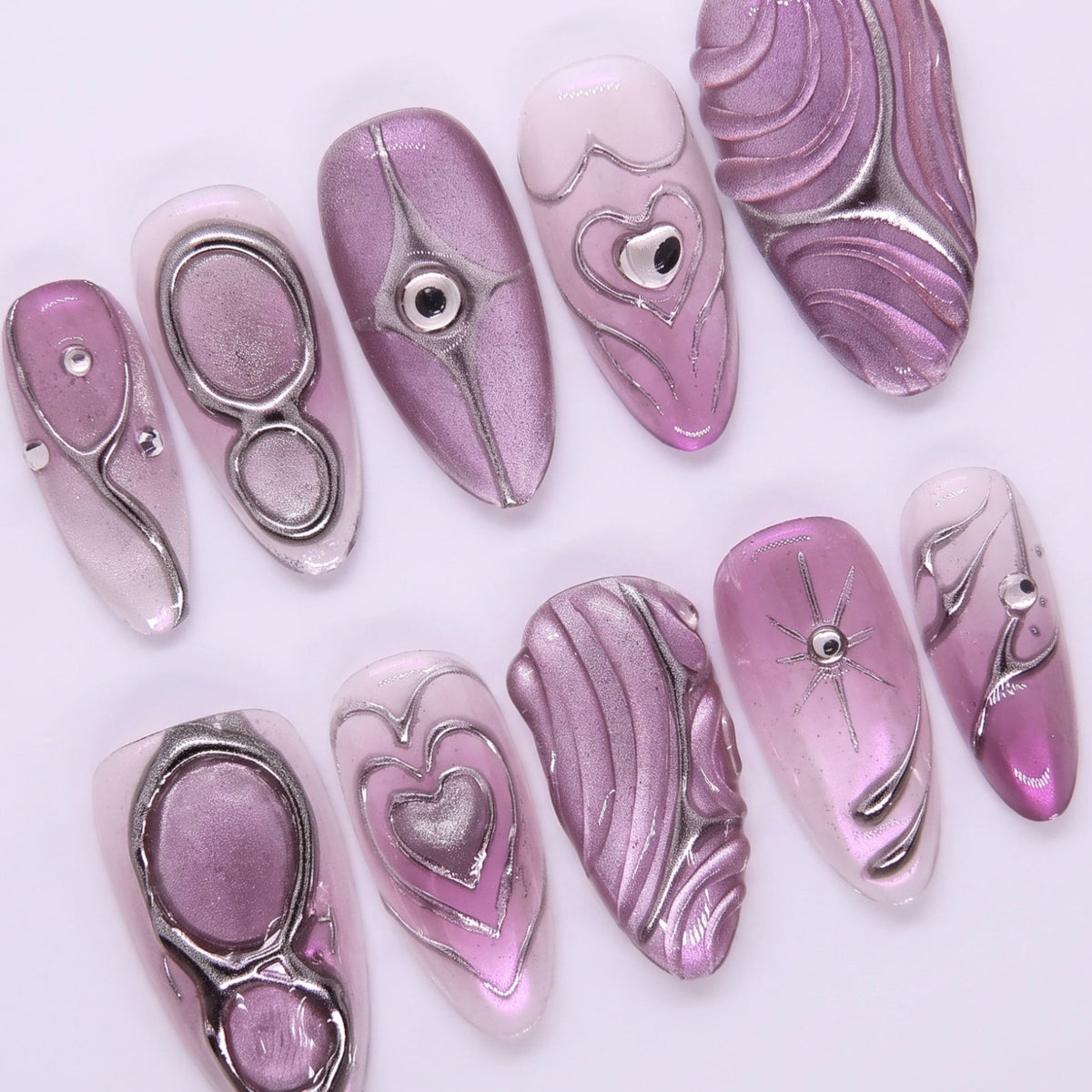 Lilac gradient nail with rhinestone shimmer.