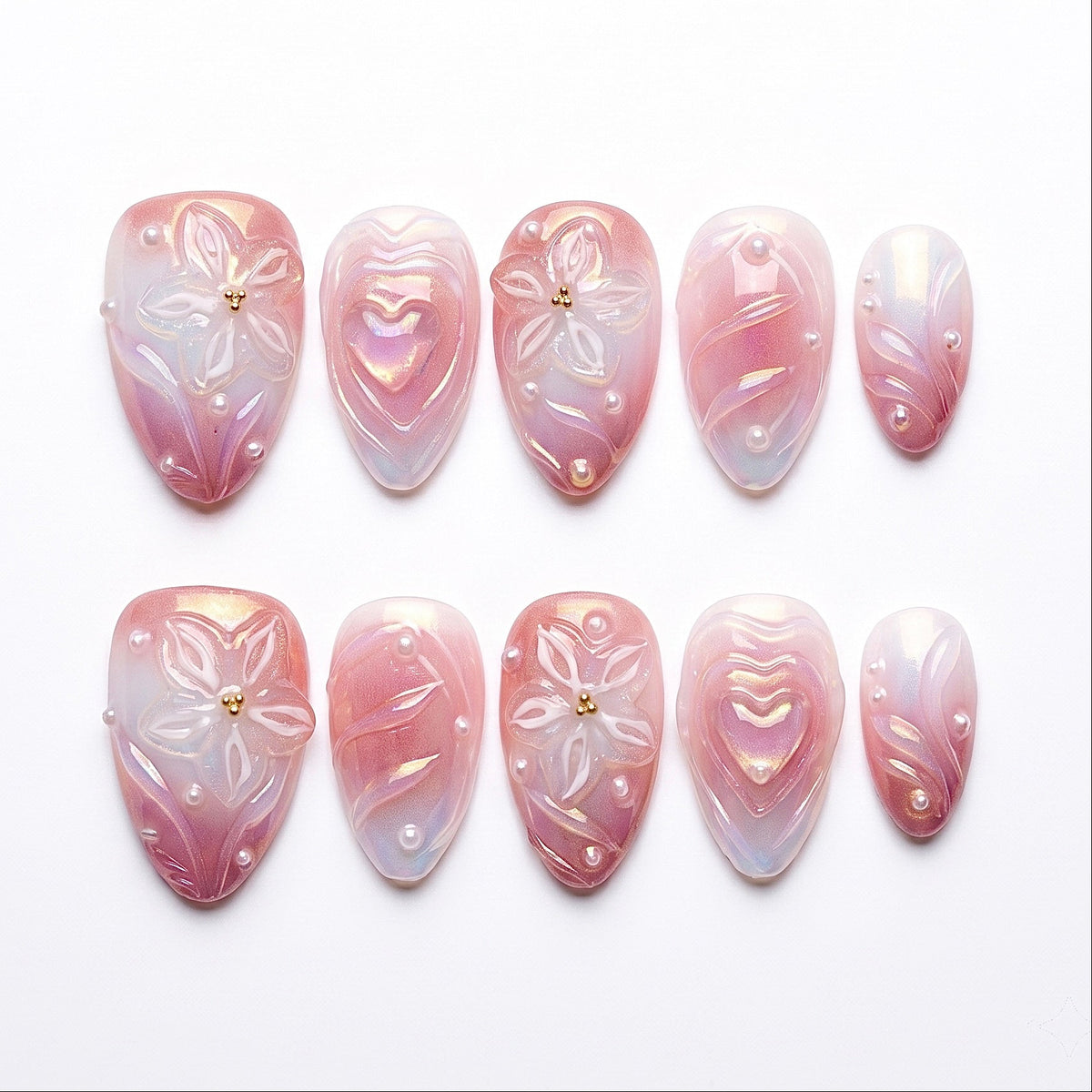 Detailed view of 3D heart centerpiece with shimmer finish on soft girl press-on nails.