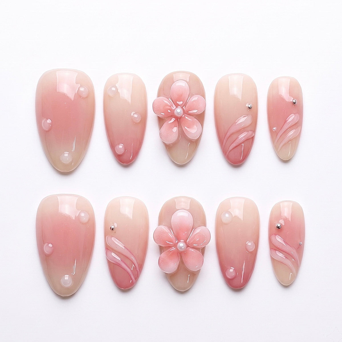 Morning Dew press-on nails with nude-pink gradient, pearl-centered flower, and dew-drop accents – soft Earth · Calm design by Nailsium.