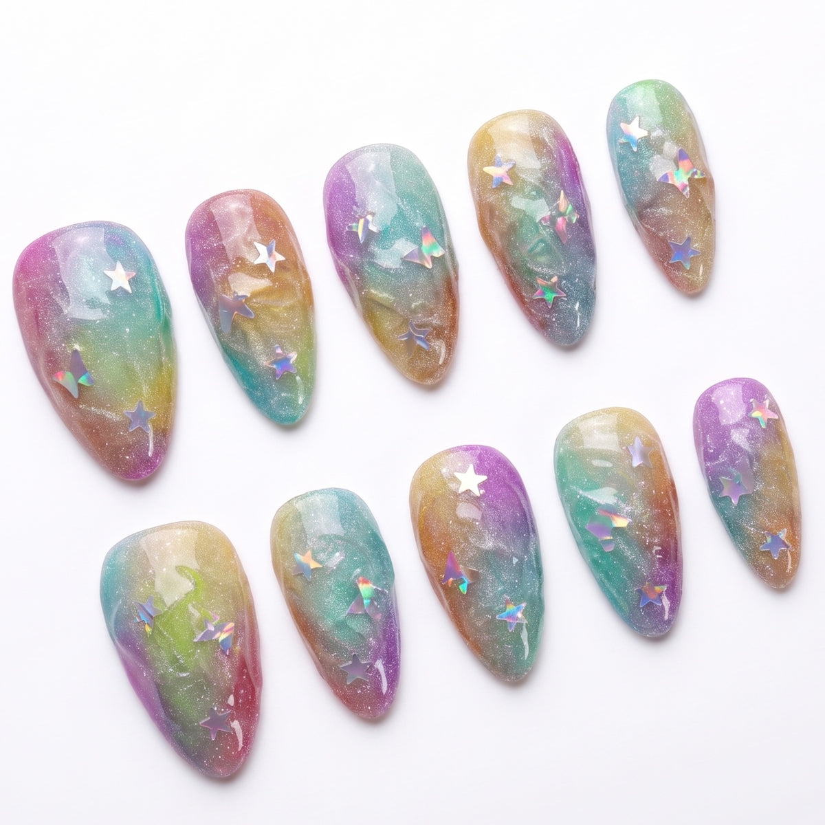 Close-up of nail with pastel cloud-like texture and translucent star confetti.