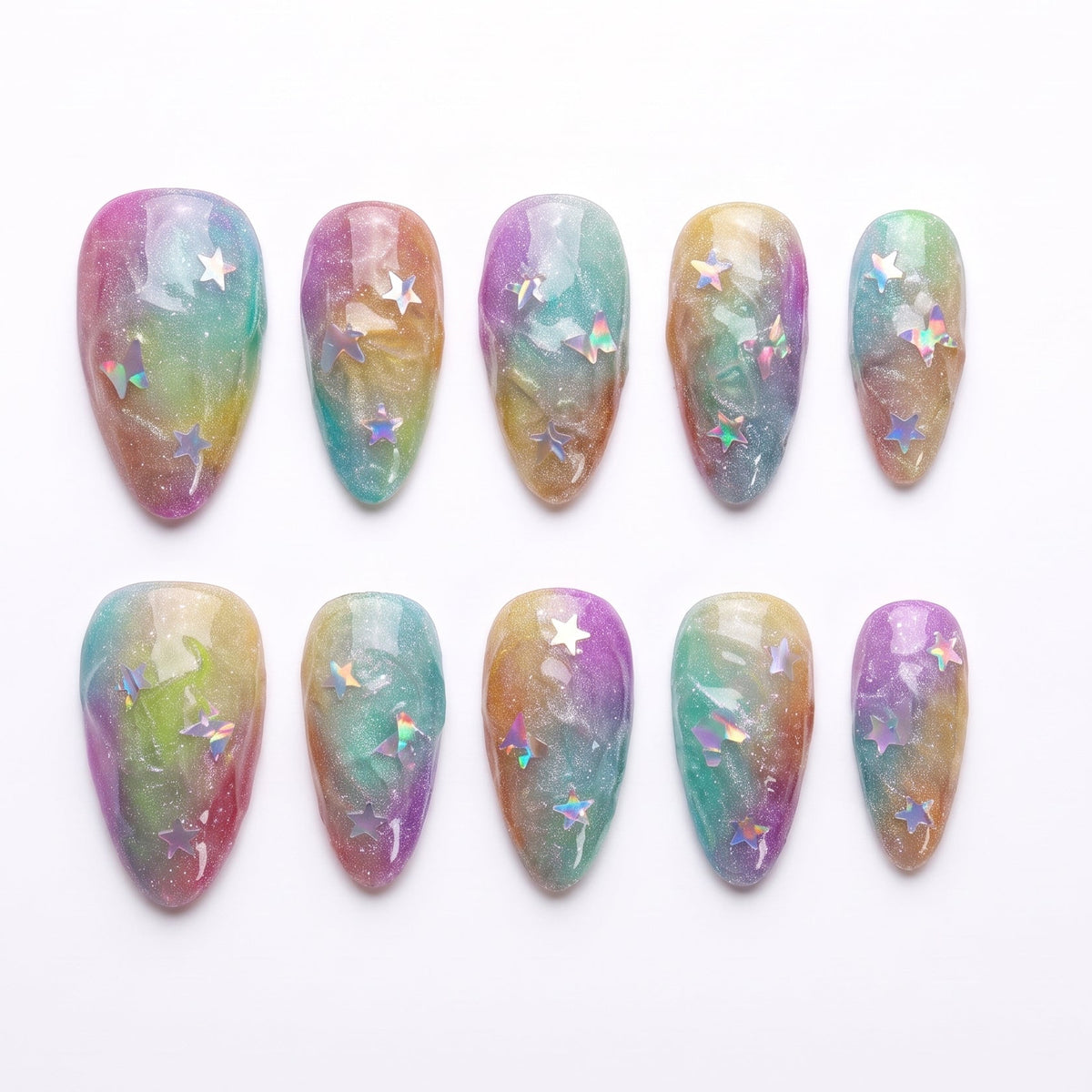 Top view of Fairy Shells press-on nails with iridescent rainbow shimmer and holographic star sequins.