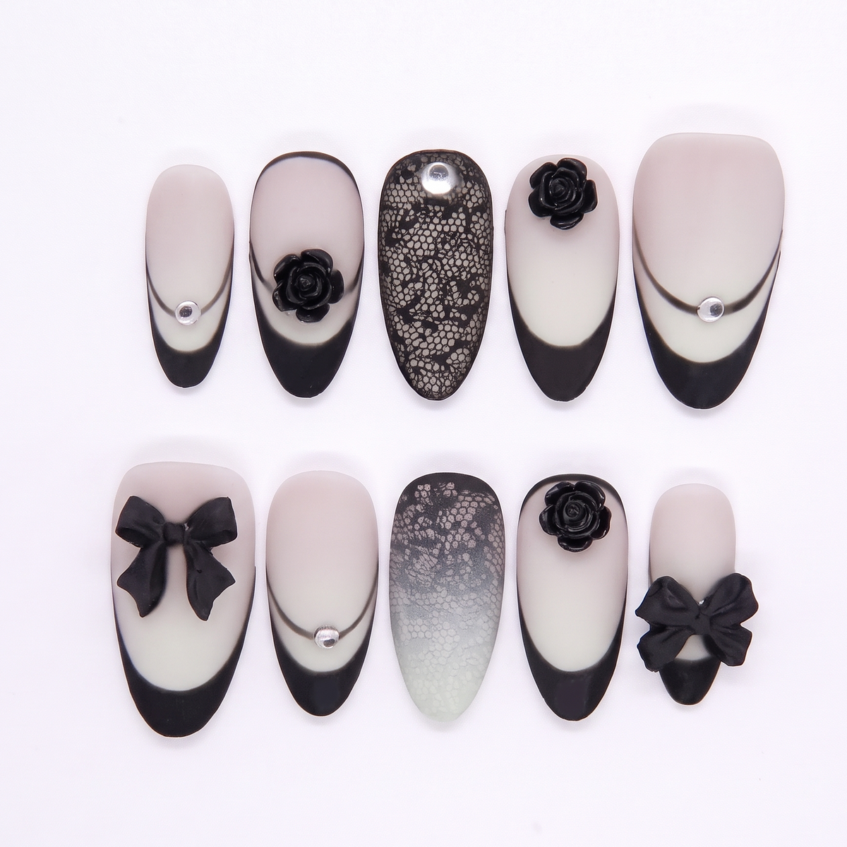 Black French tip press on nails with matte finish, lace design, and 3D rose and bow accents.