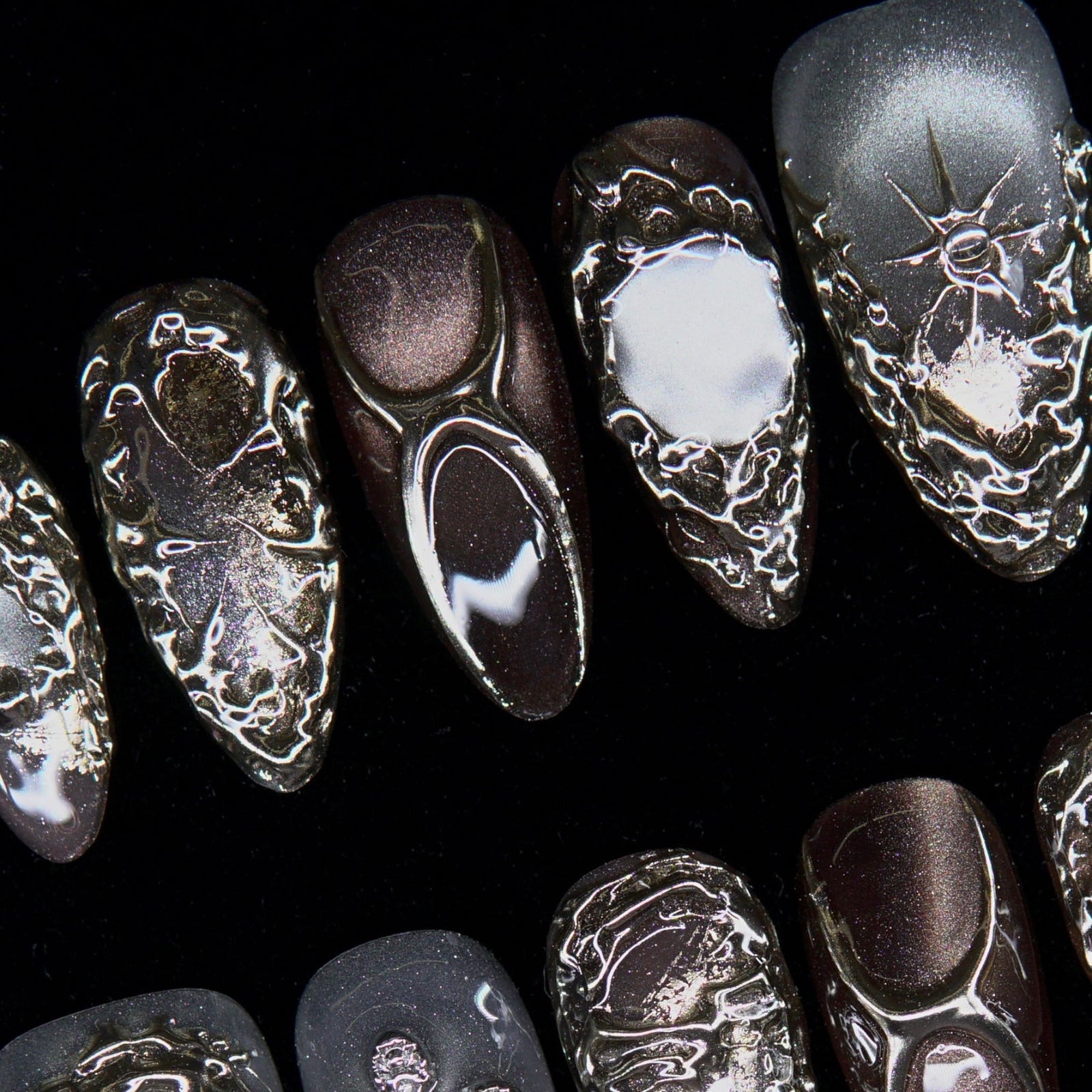 Textured metallic surface with alchemical depth and shimmer.