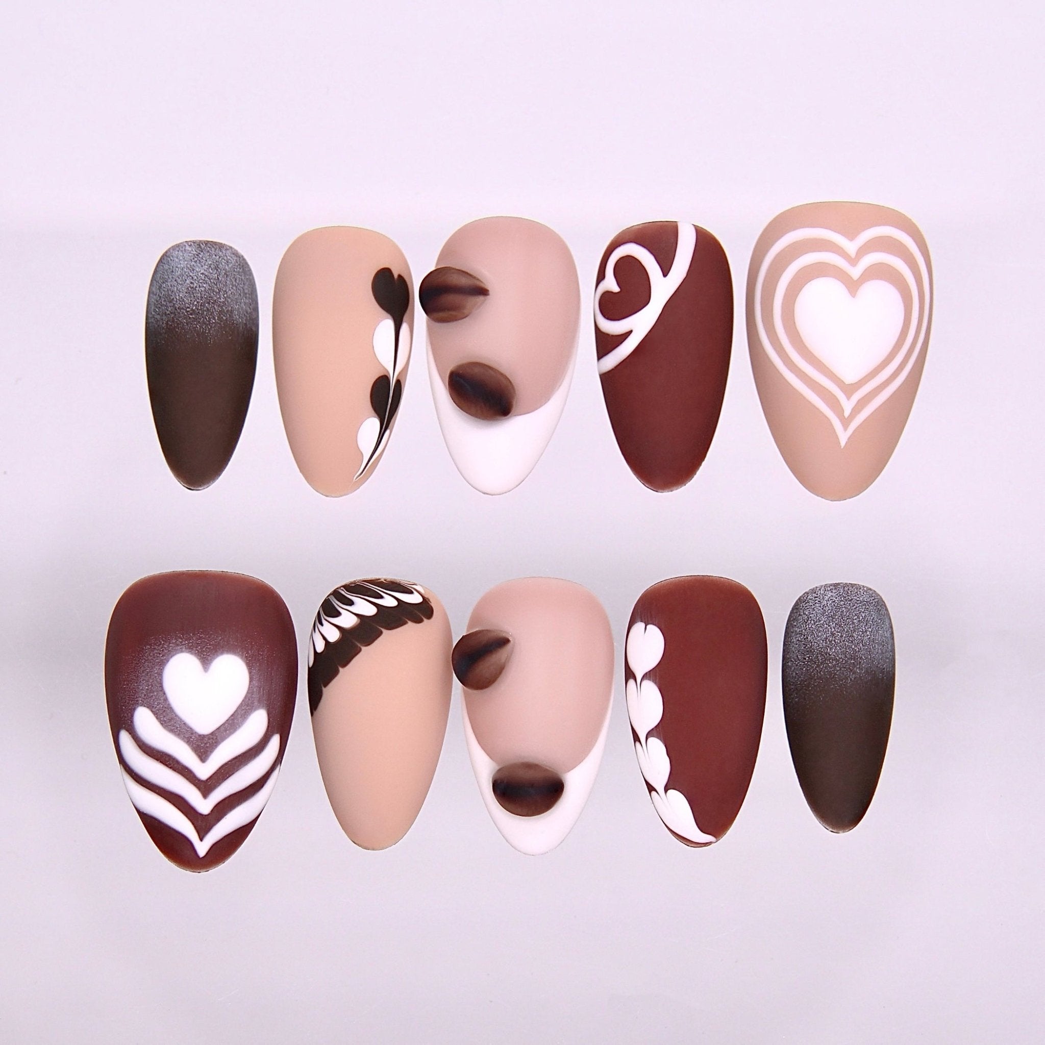 Begin with Care press-on nails set featuring coffee-inspired latte art designs in mocha, cocoa, and cream tones