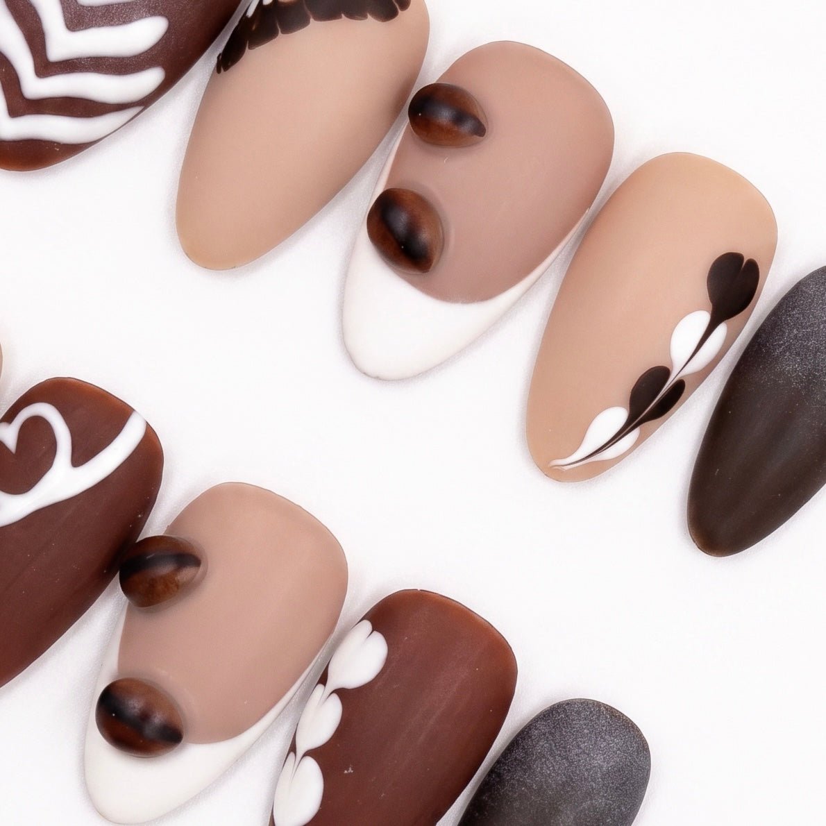 Detail view of Begin with Care press-on nails highlighting warm coffee-toned palette and soft matte finish
