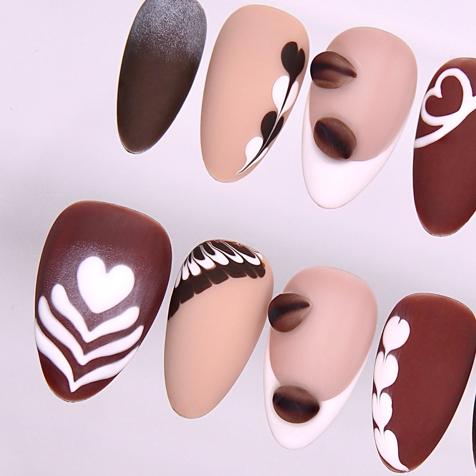 Detail view of Begin with Care press-on nails highlighting warm coffee-toned palette and soft matte finish
