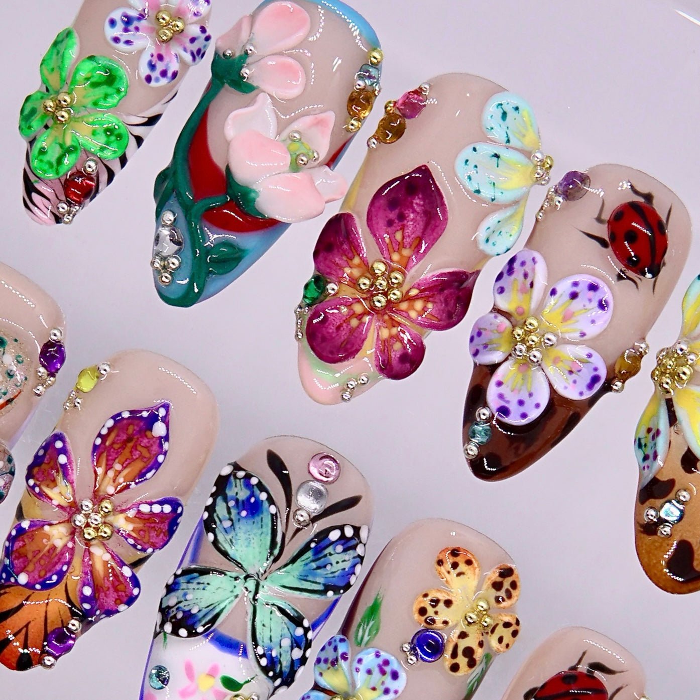 Mixed color floral press on nails with ladybug and glossy details