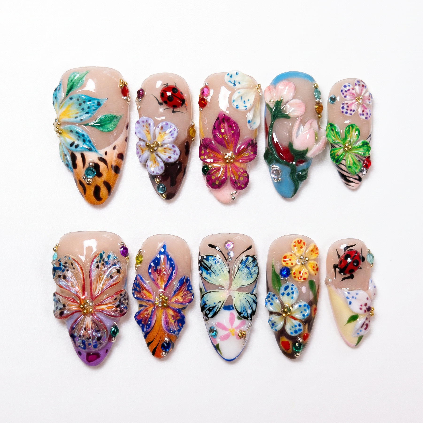 3D flower and butterfly nail art with rhinestone accents