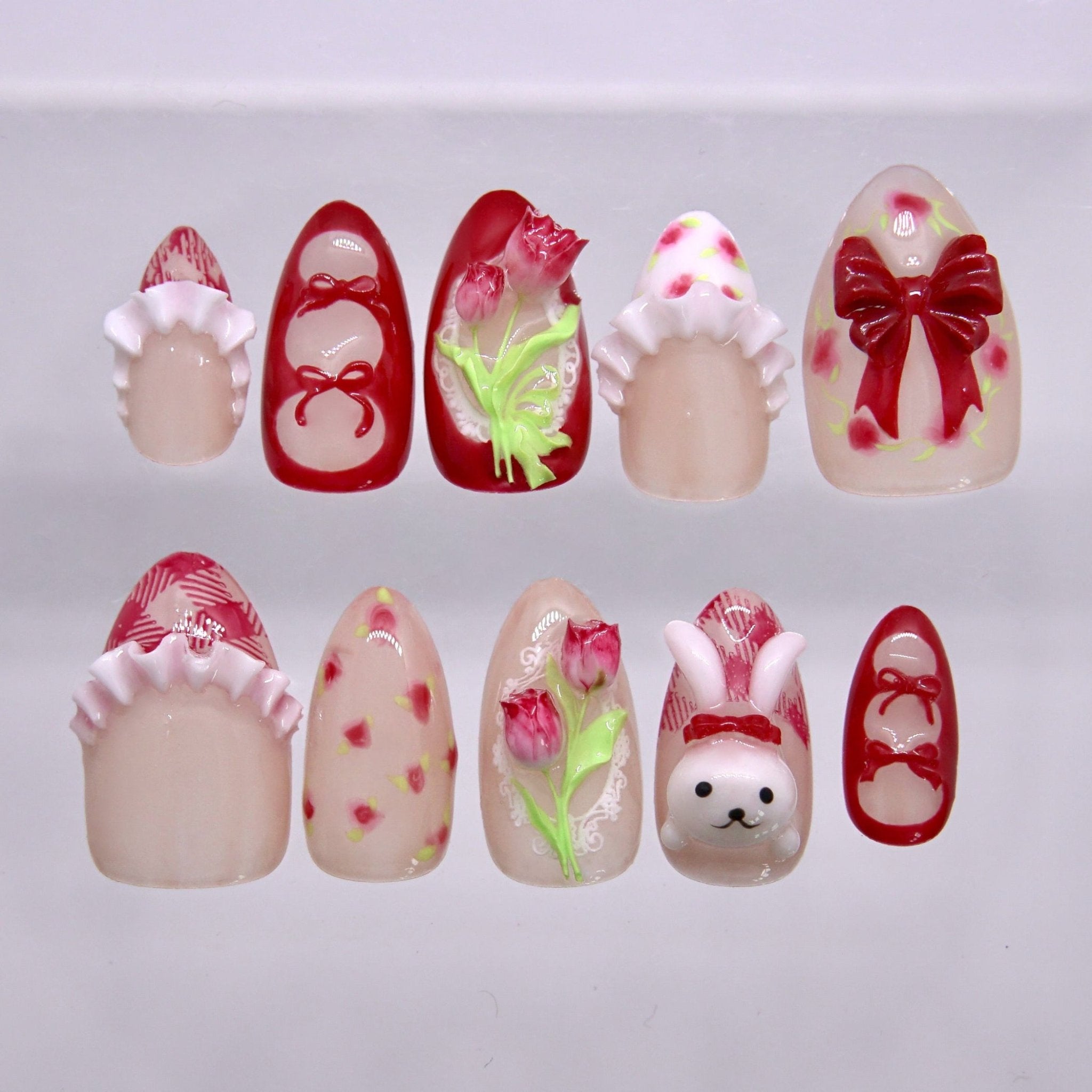 Sweet cherry red and floral press on nails with a cute bunny design. Perfect for Easter, spring outfits, and soft playful looks.