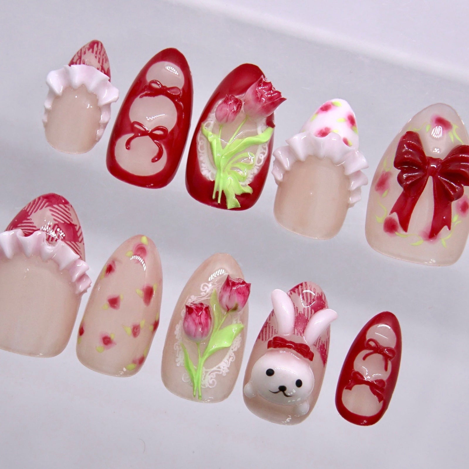 Cherry red and pink Easter bunny press on nails with floral and bow design
