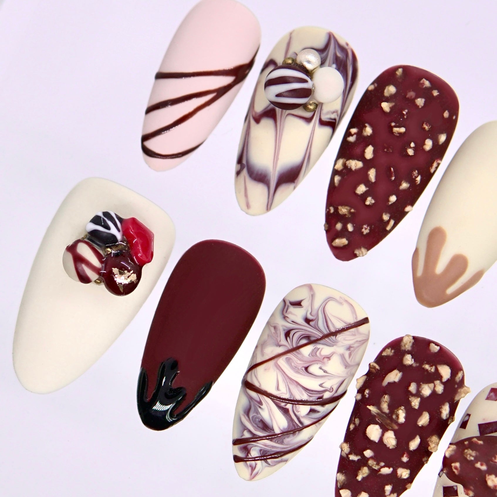 Textured chocolate toned press on nails with scattered decorative elements