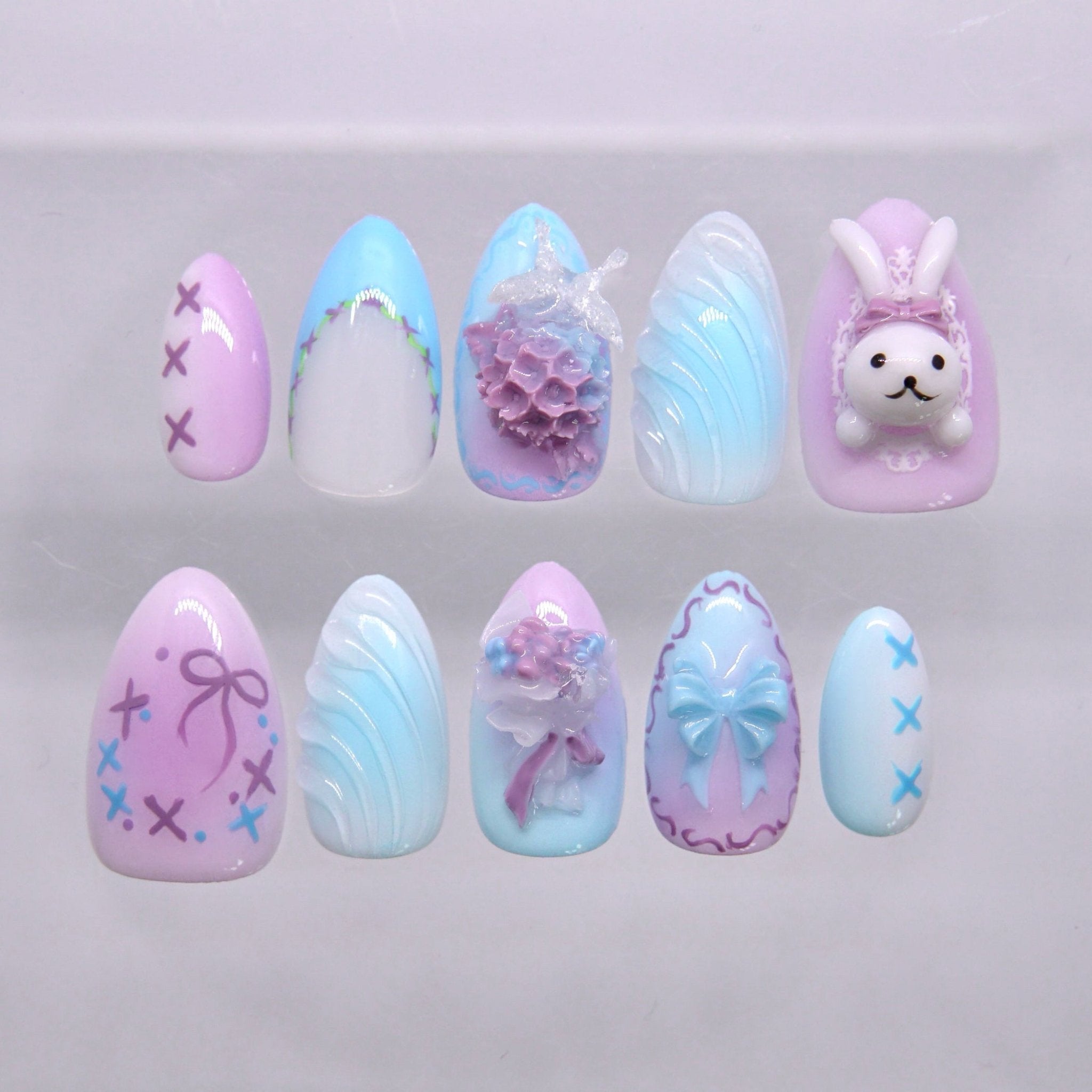 Pastel blue and purple bunny press on nails with soft floral and bow design