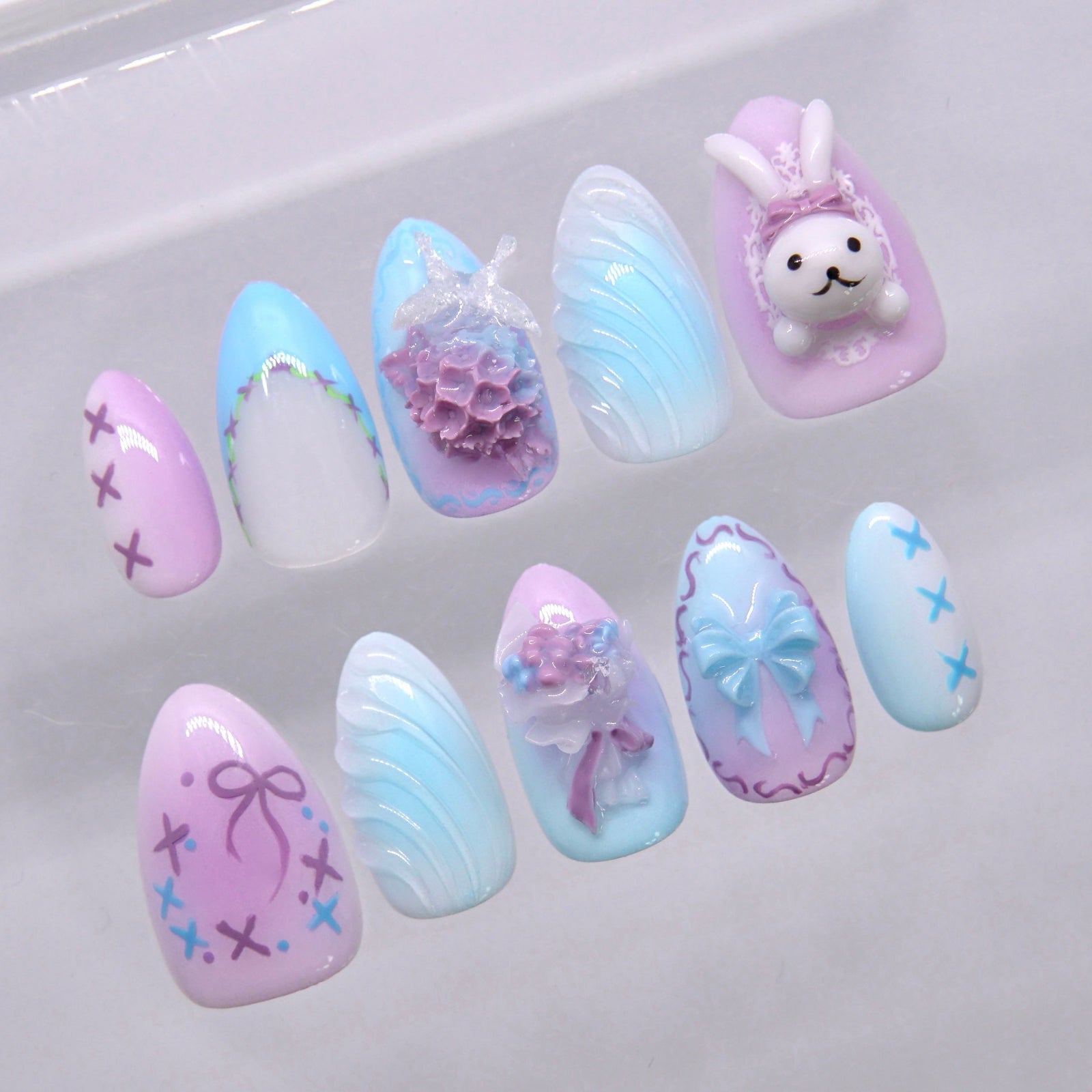 Pastel blue and purple bunny press on nails with soft floral and bow design