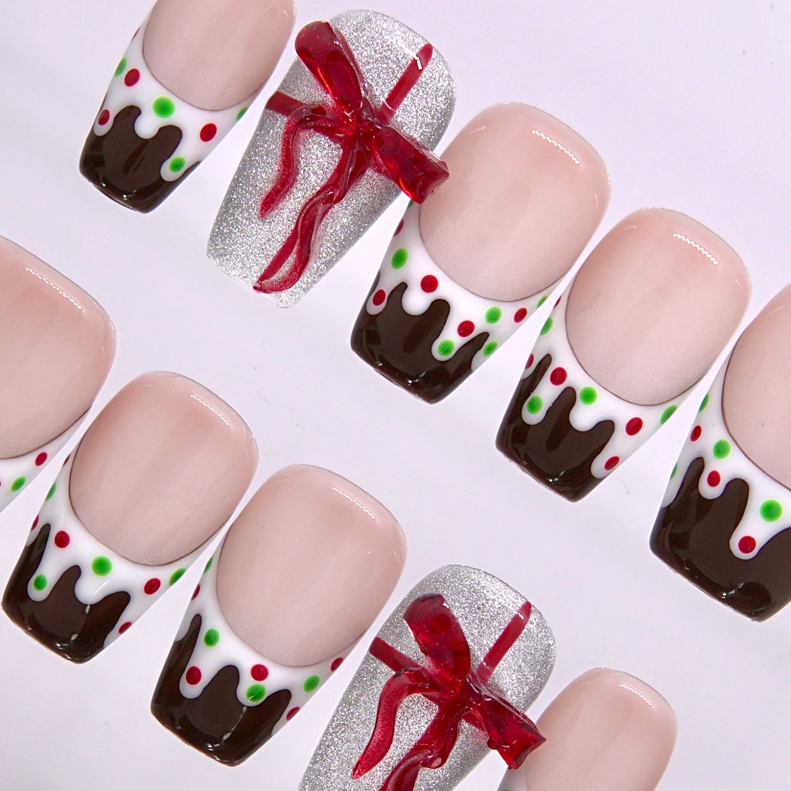 Festive dessert inspired press on nails showing cocoa drips creamy white edges and candy dots.