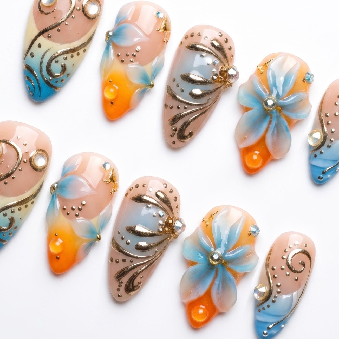 Hand painted floral press-on nails with chrome details by Nailsium