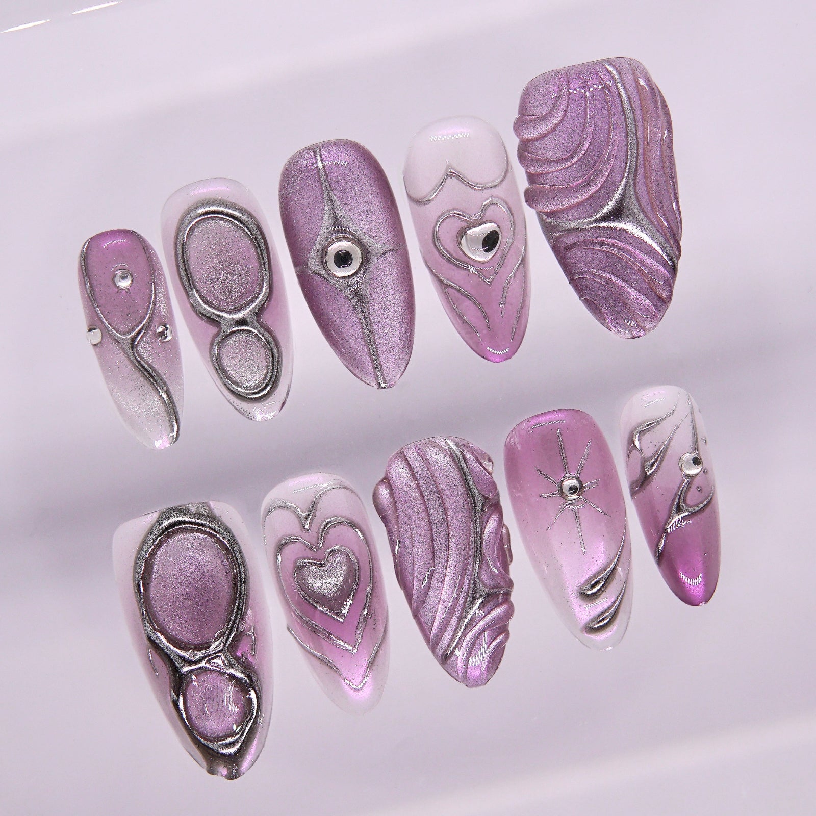Close-up of silver chrome outline and 3D crystal heart.