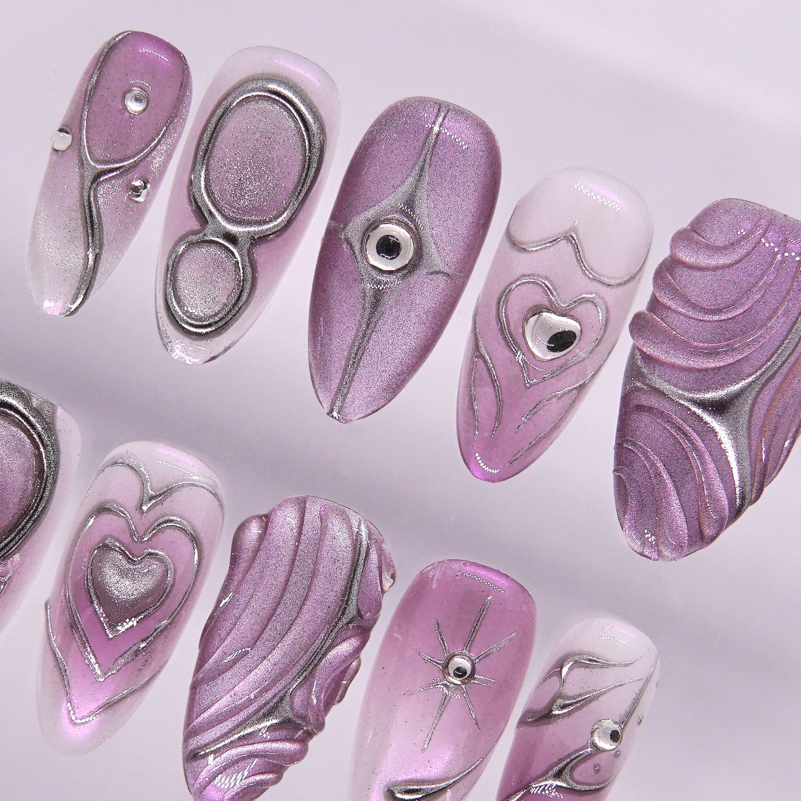 Lilac gradient nail with rhinestone shimmer.