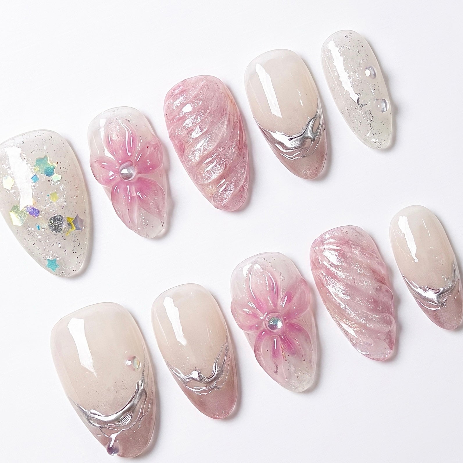 Detailed view of Dewdrop Serenade nail art with sculpted pink flowers, shimmering water-like textures, silver lines, and iridescent accents