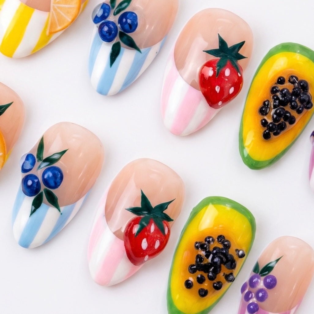 Hand painted fruit press-on nails with colorful summer details by Nailsium