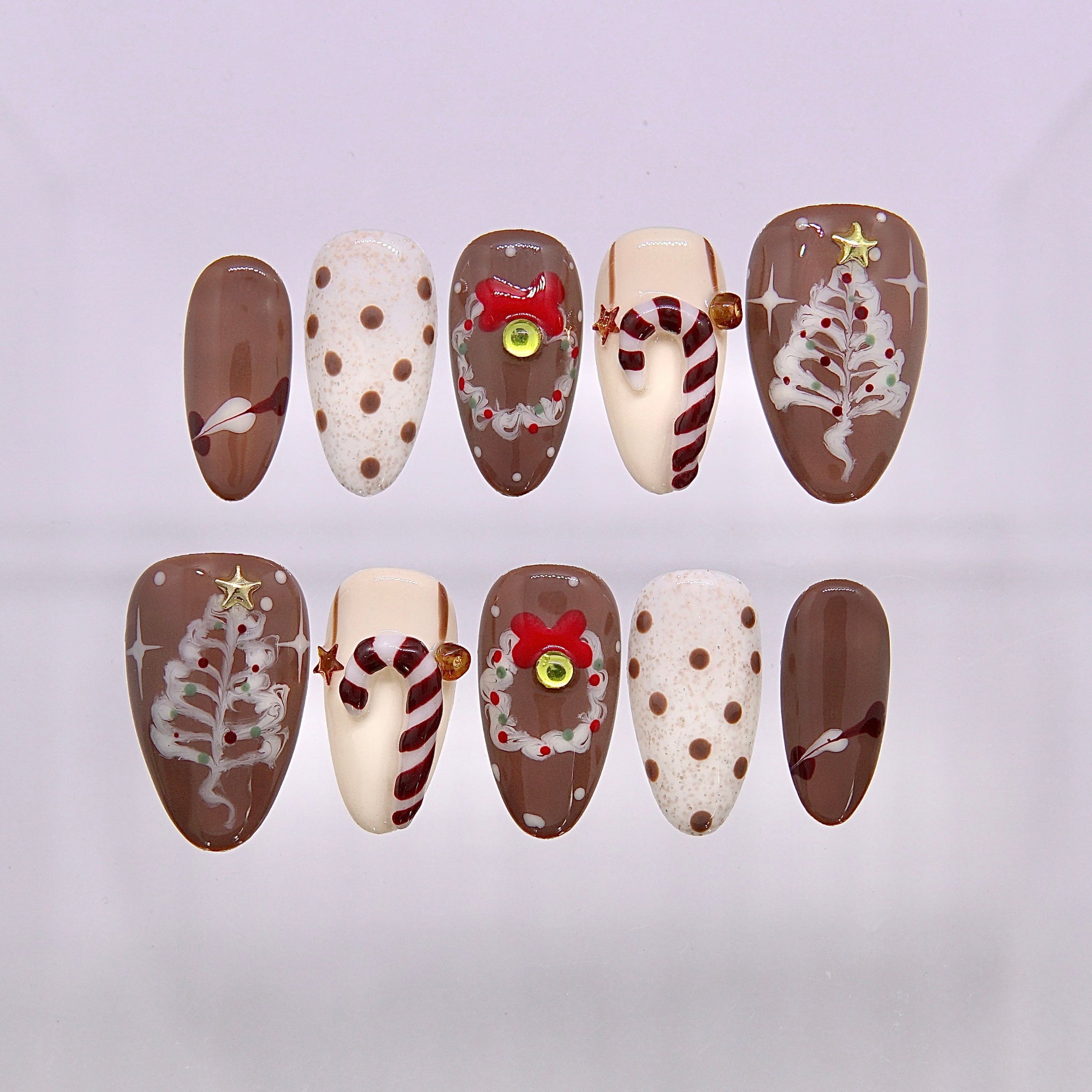 Gingerbread Latte Christmas press on nails in warm coffee browns with tiny gingerbread details and creamy white accents.