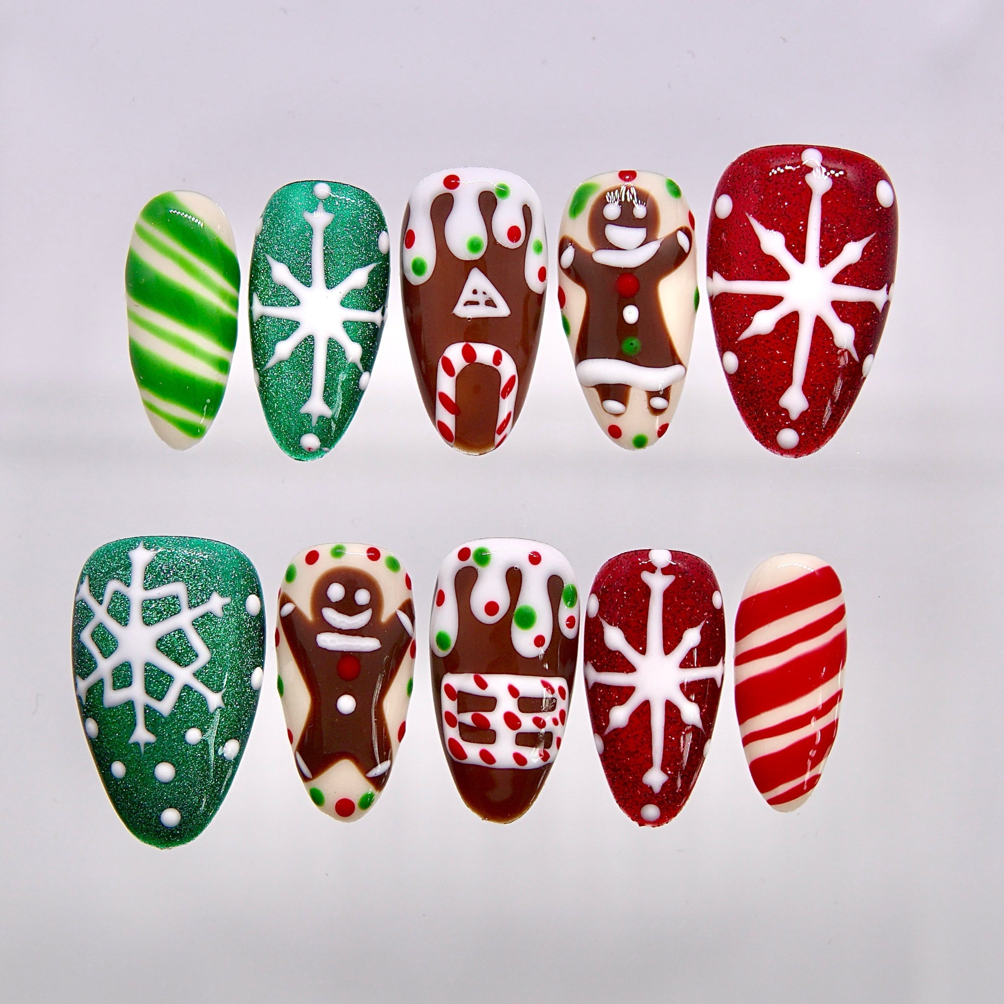 Gingerbread Wishes Christmas press-on nails with gingerbread, snowflakes, and candy cane designs