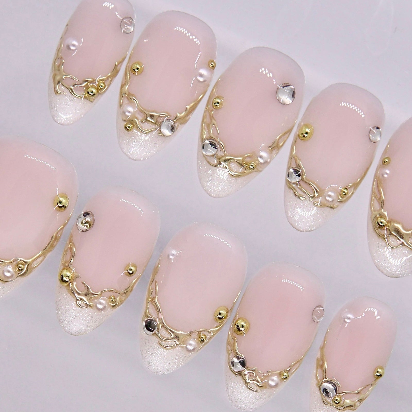 Minimal nail design with soft nude tones and subtle shine
