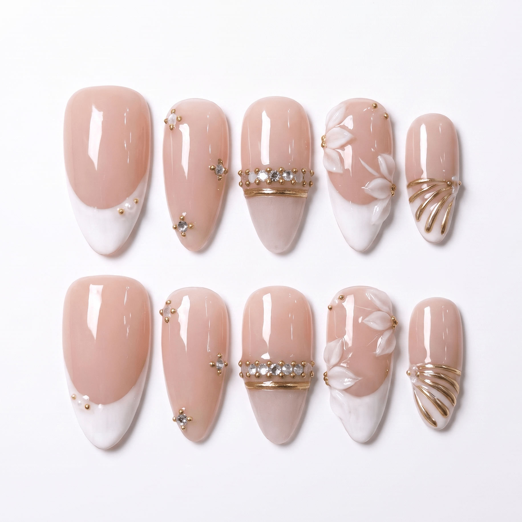 Ivory Petal Waltz handmade press-on nail set with nude blush bases, ivory tips, sculpted white petals, crystal bands, and gold accents by Nailsium