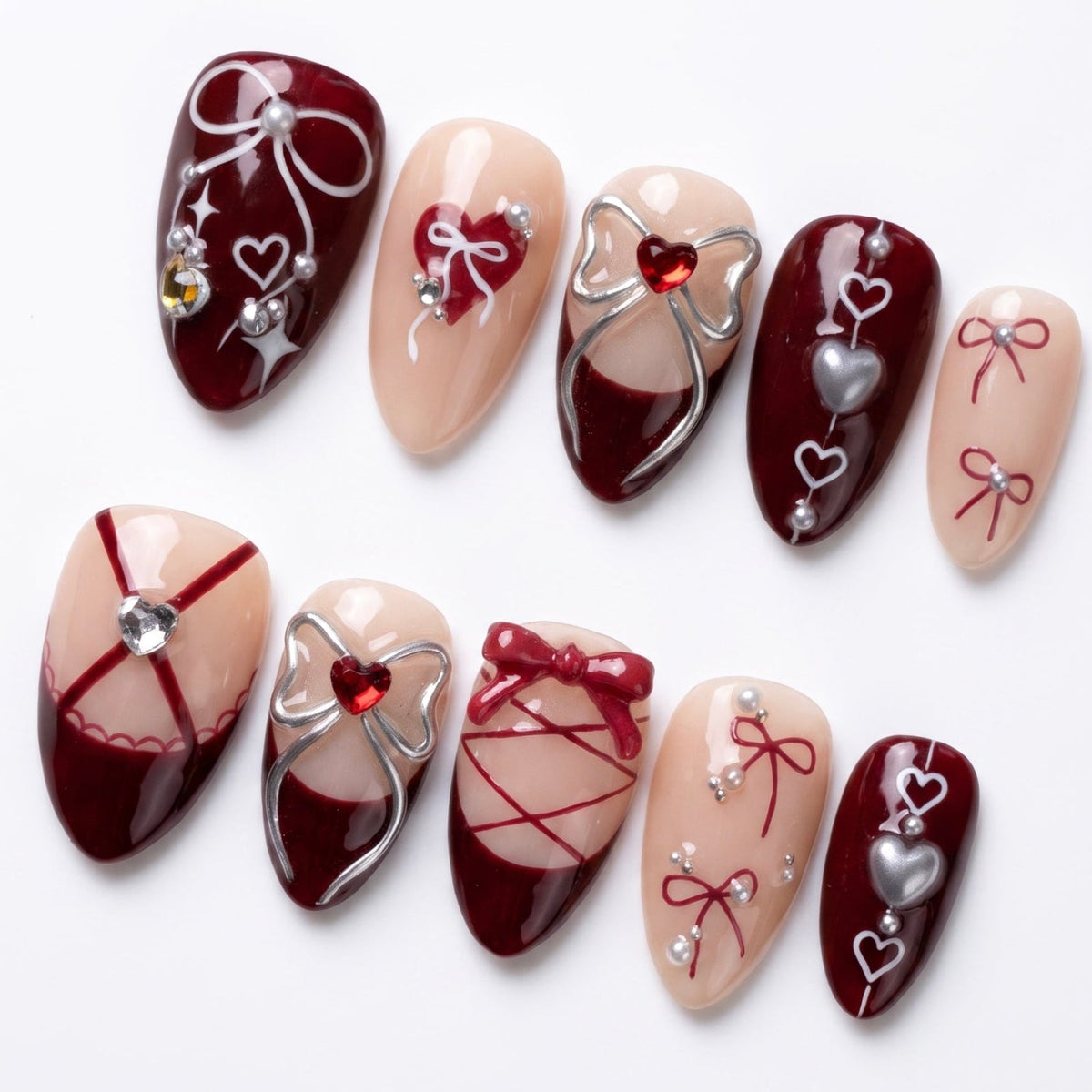 Wine red press on nails featuring corset details and glossy finish.