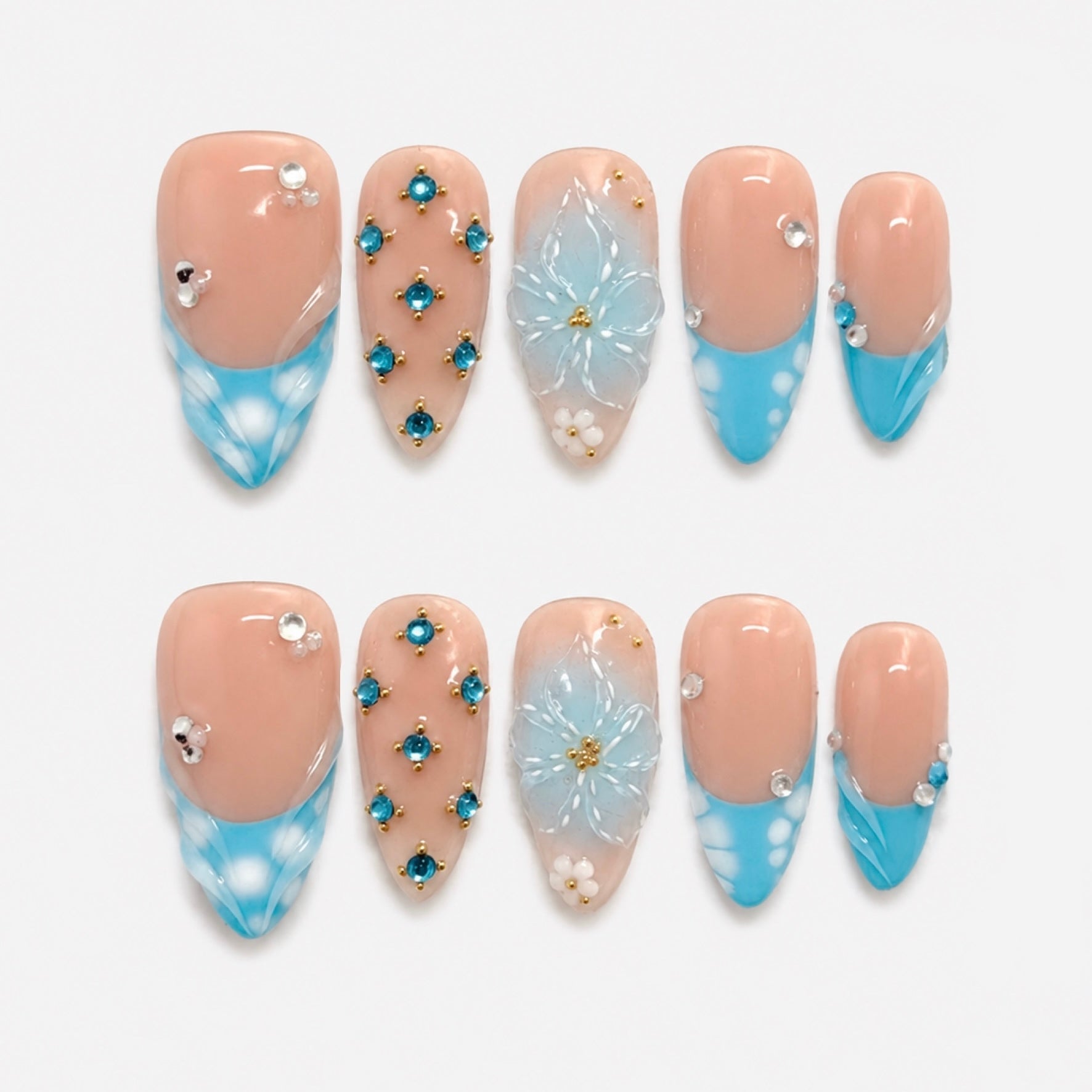 Pink seashell inspired handmade press-on nails by Nailsium