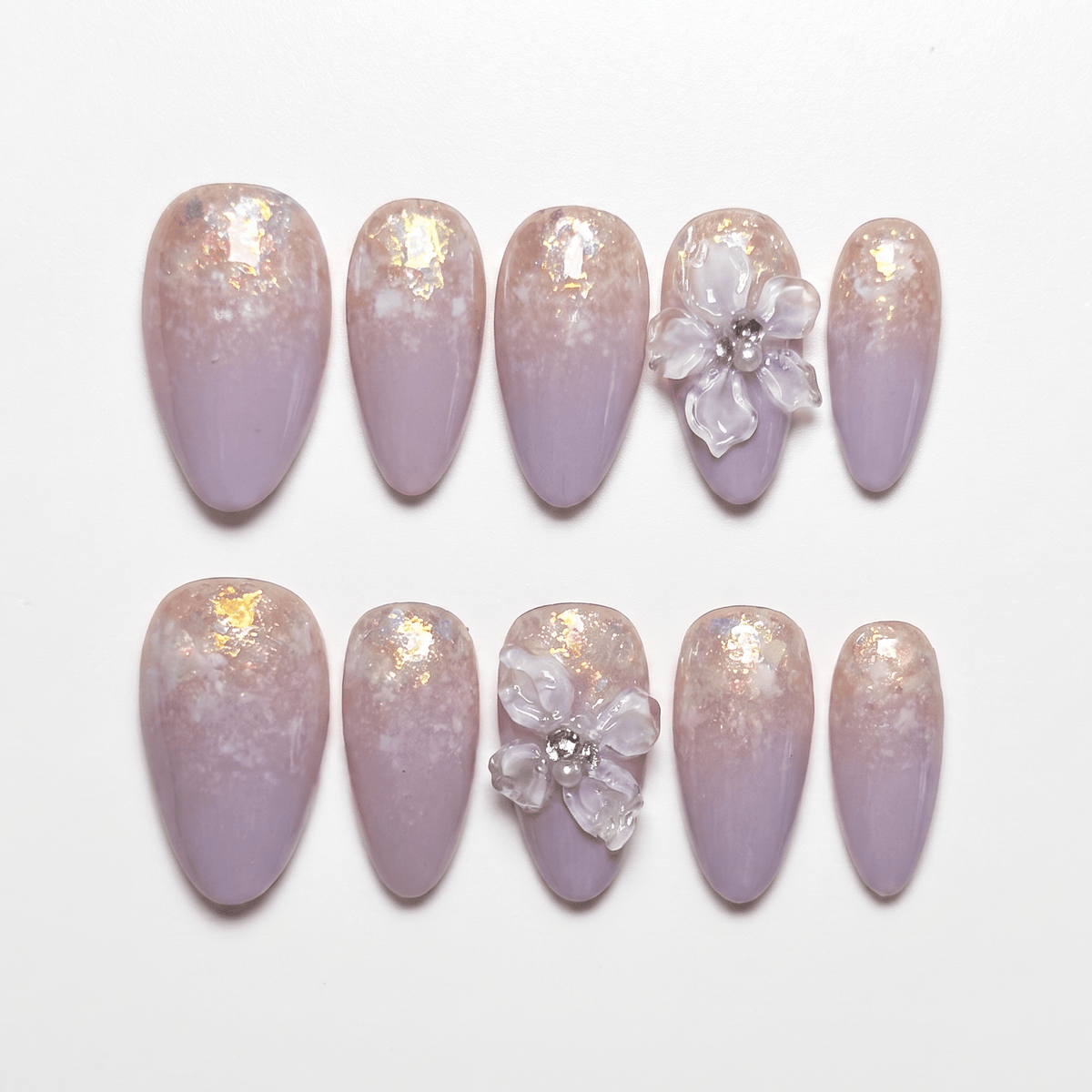 Dreamy lavender press-on nails with ombré shimmer and floral 3D accents from Blooming Hour Series.