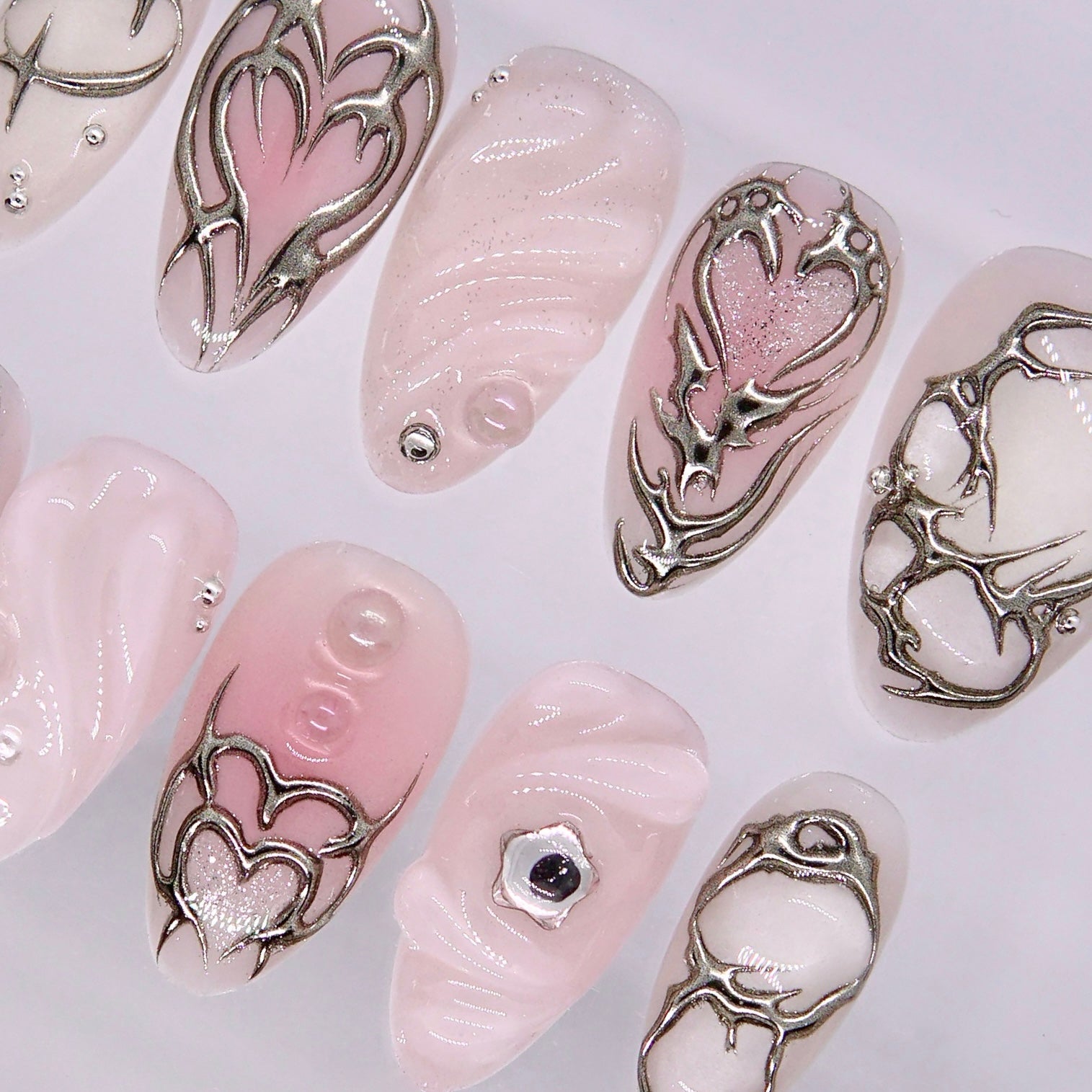 Romantic silver swirl and heart press on nail design