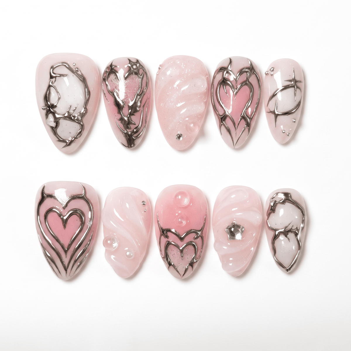 Soft pink heart themed press on nails with silver chrome details