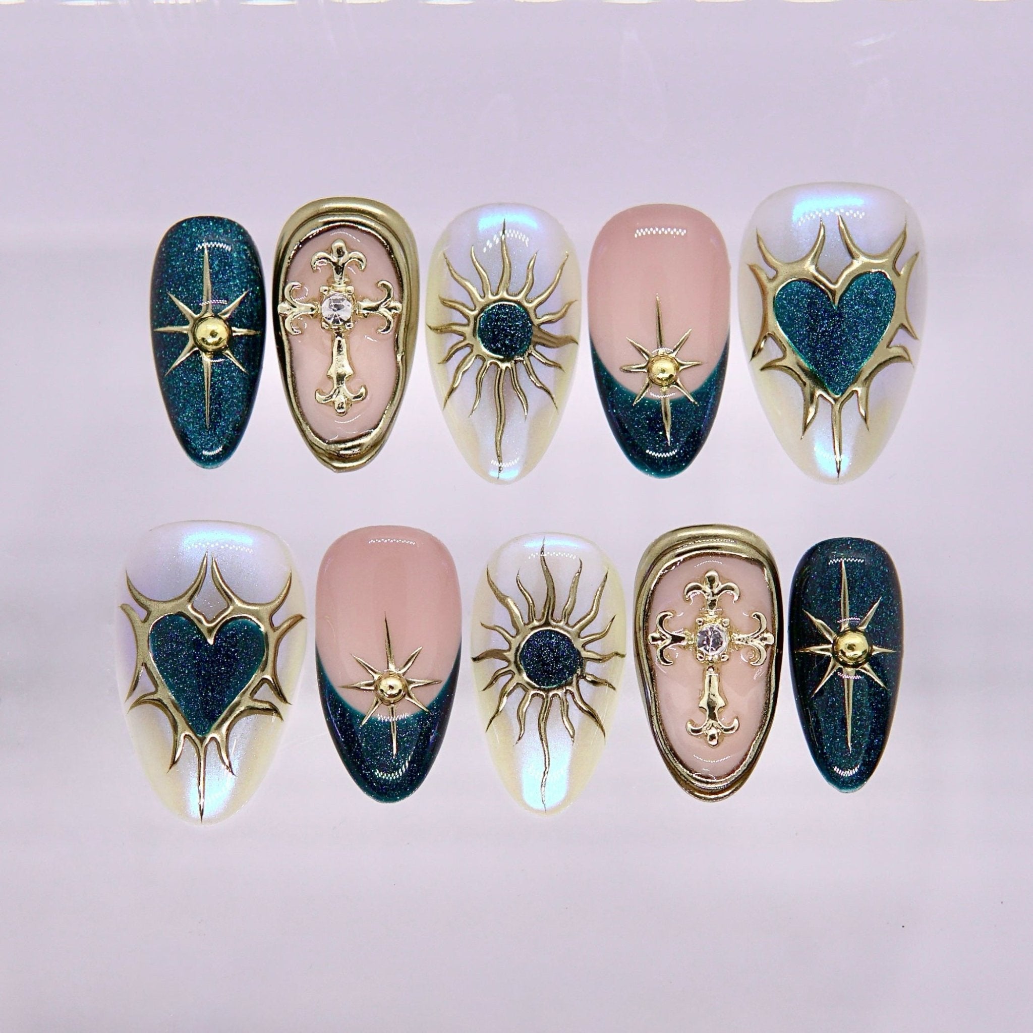 Blue and gold press on nails with celestial design and metallic details