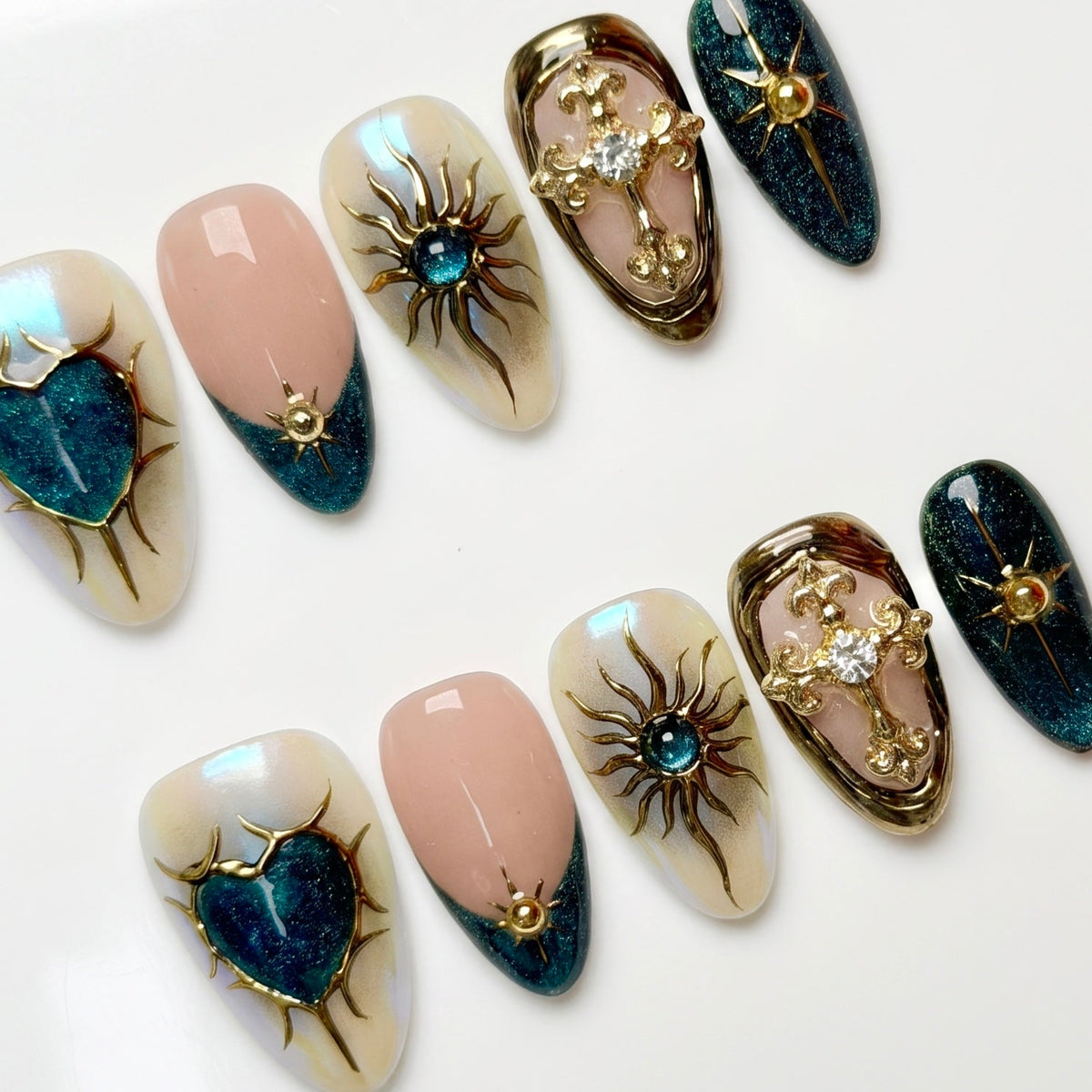 Close-up of deep blue nails with gold star and symbol accents